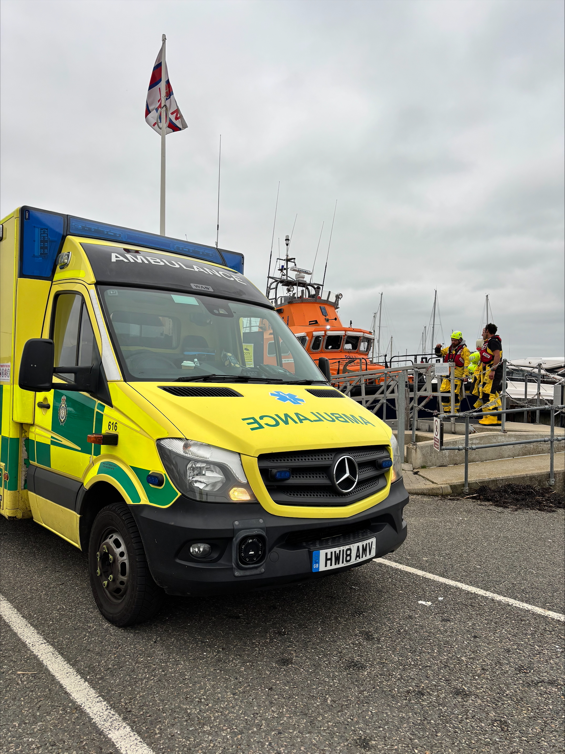 IOW ambulance service meeting Yarmouth RNLI at their berth in Yarmouth Harbour