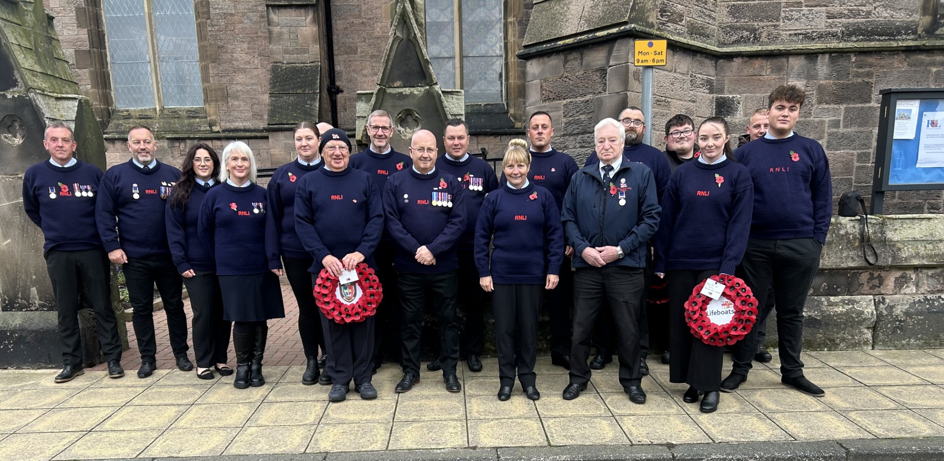 RNLI Crew assembled outside St Andrews Church for Remembrance Parade 
