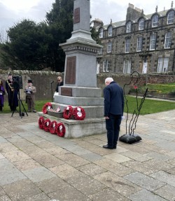 Retired Coxwain Michael Ross laying wreath at Spittal War Memorial