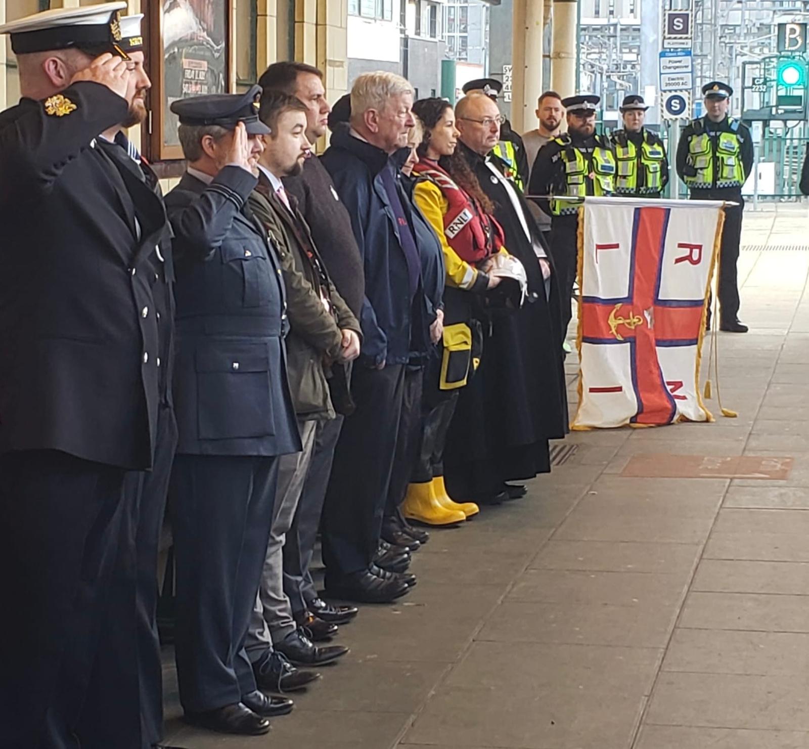 The lifeboat party await the train at Cardiff Central Station.