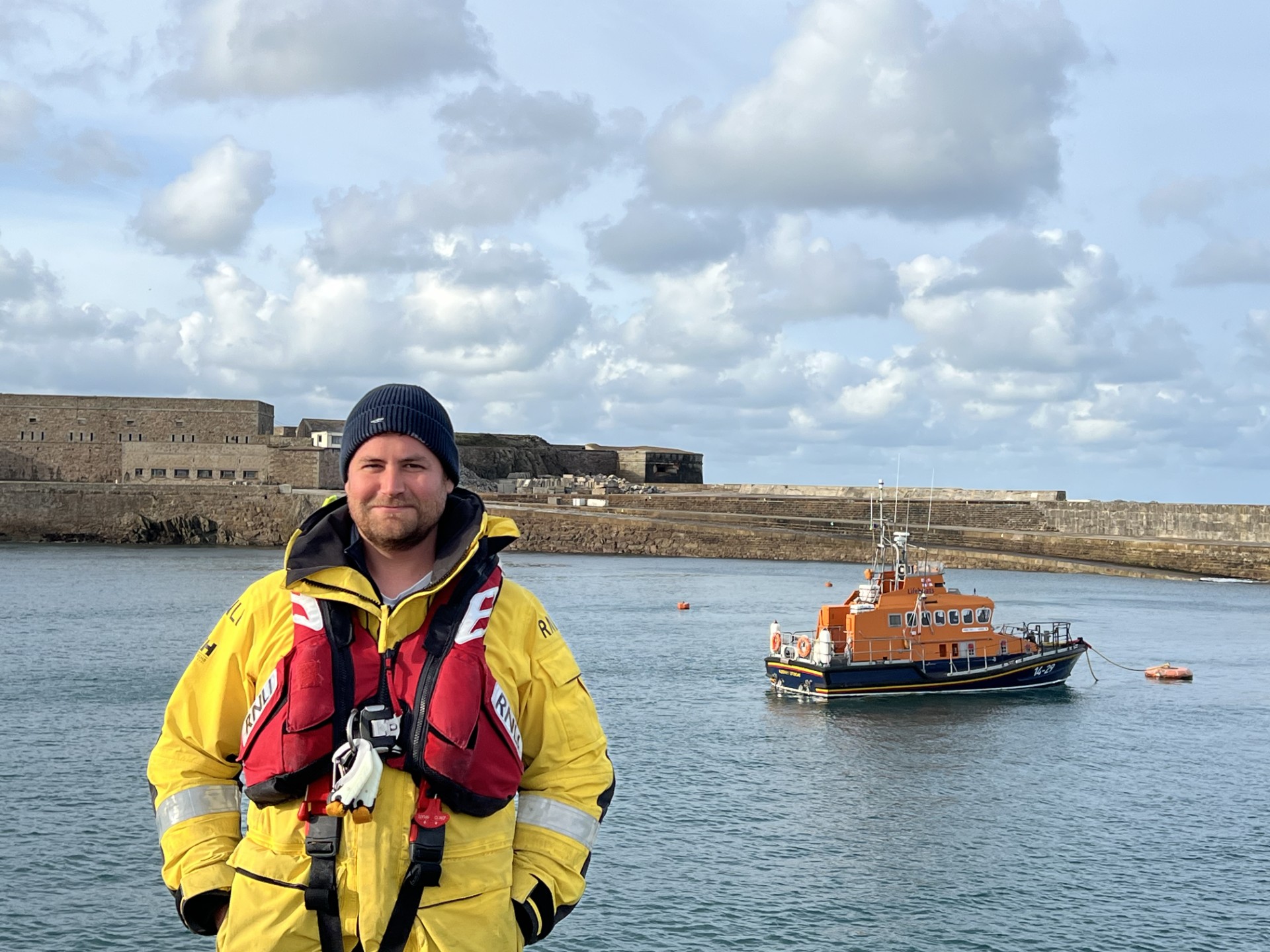 Newly fledged Coxswain - Saul Woodruff with Inner Wheel II in the background