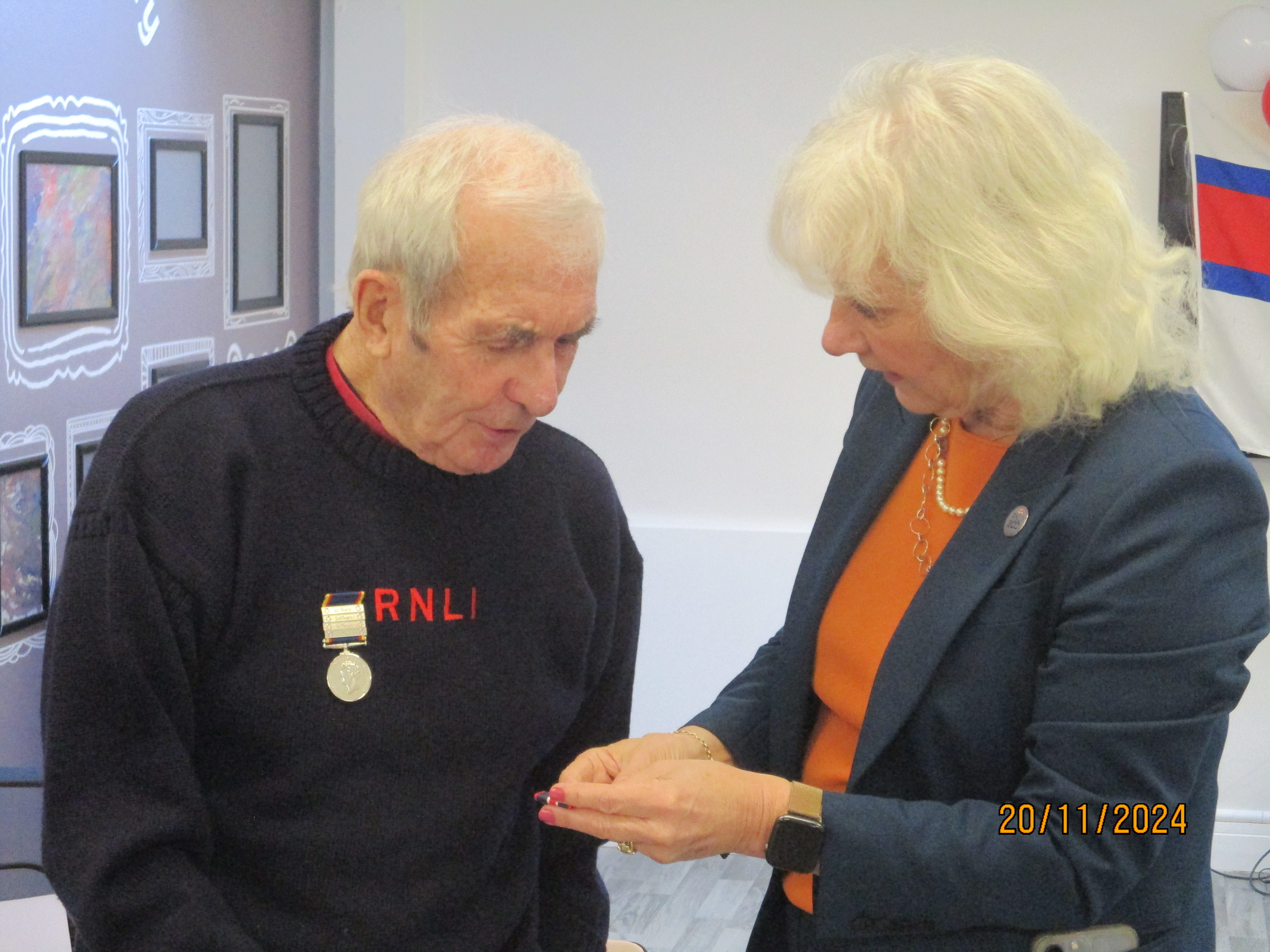 Tim (left) accompanied by His Majesty’s Lord-Lieutenant, Dr Caroline Pryer medal presentation