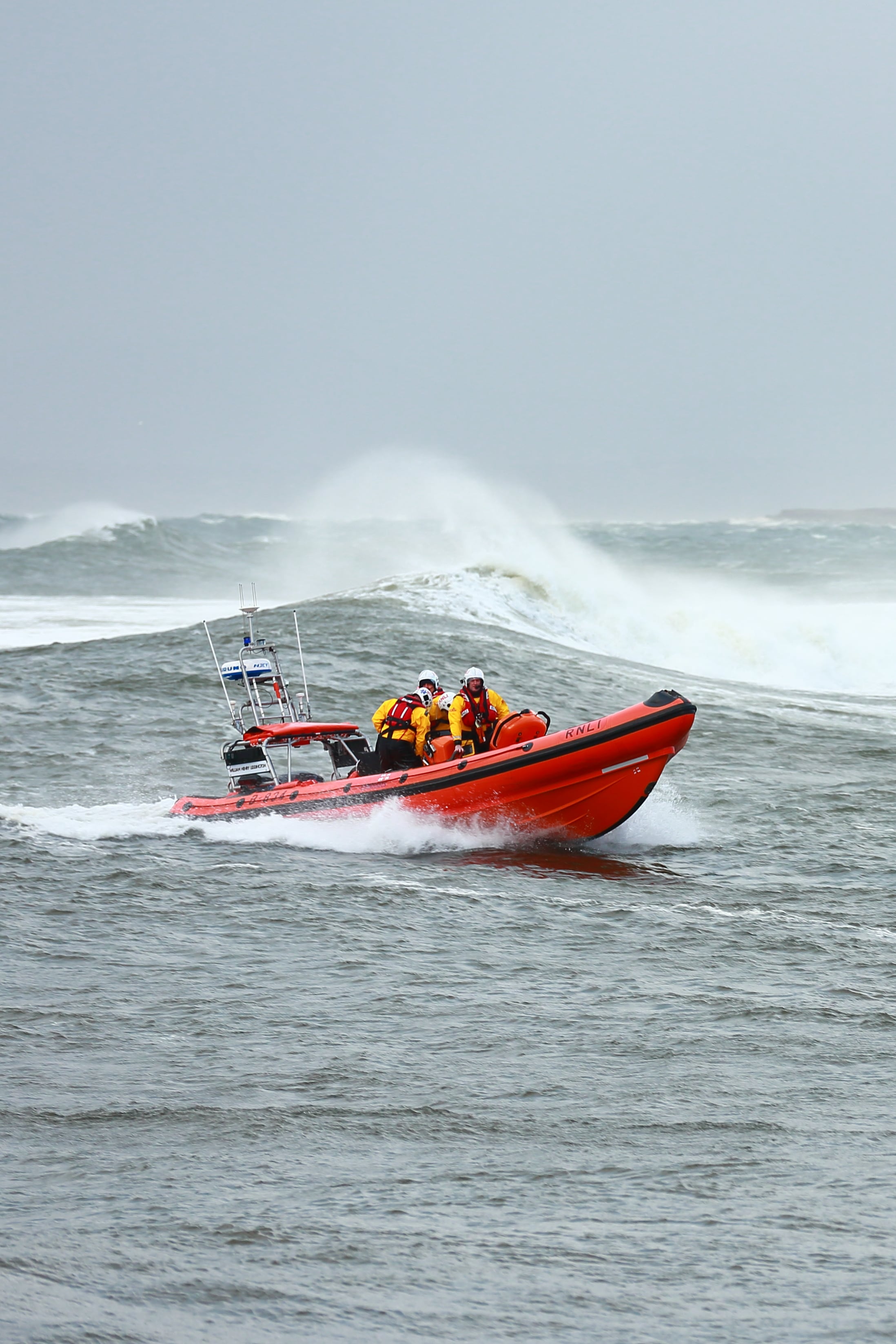 Bundoran RNLI assisting the swimmer rescued from the water.