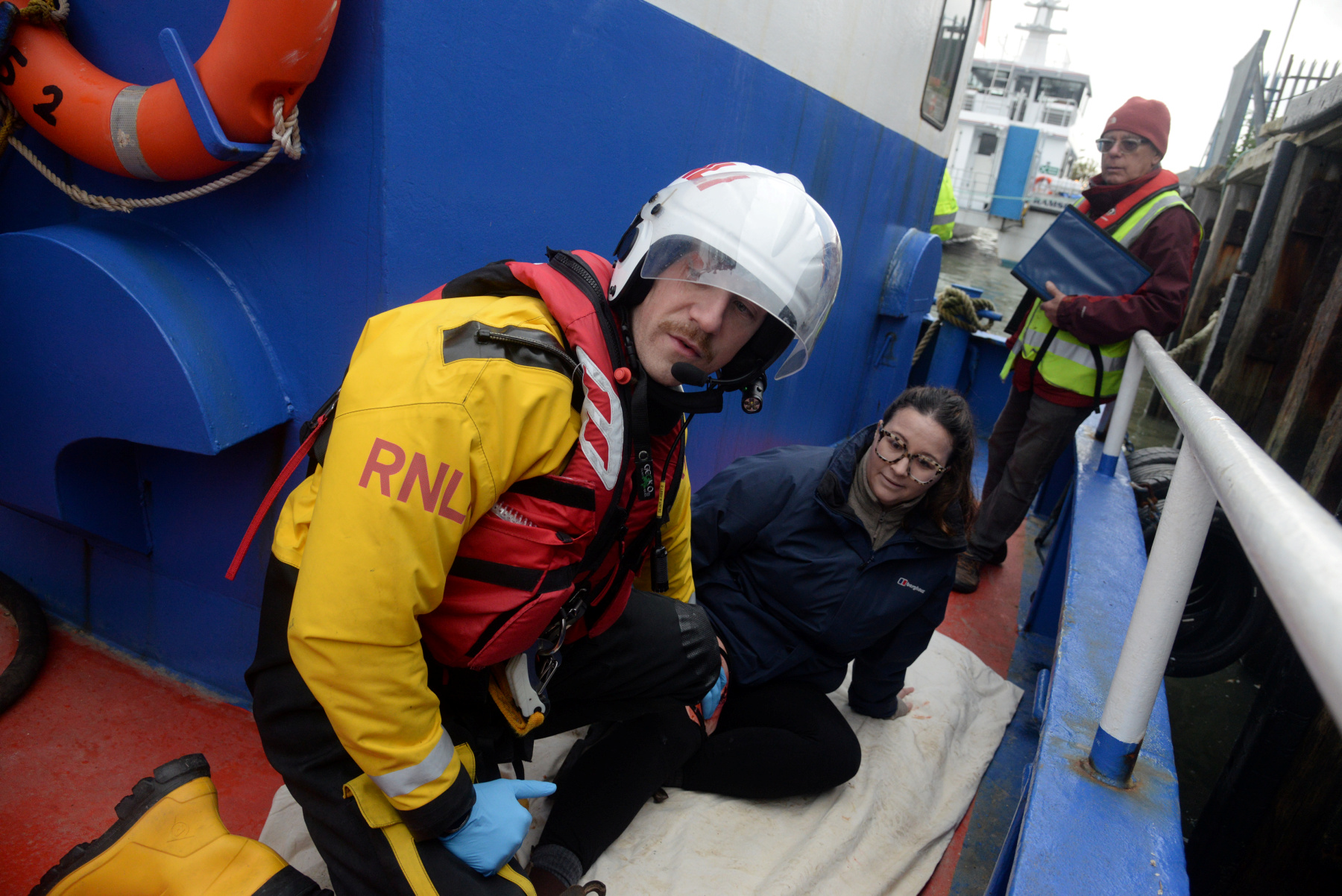 Will Smith attends to one of the caualties (Alex Vincent) with simulated injuries watched over by Dr Terry Steffani during the Whitstable RNLI Dan Davies Exercise.
