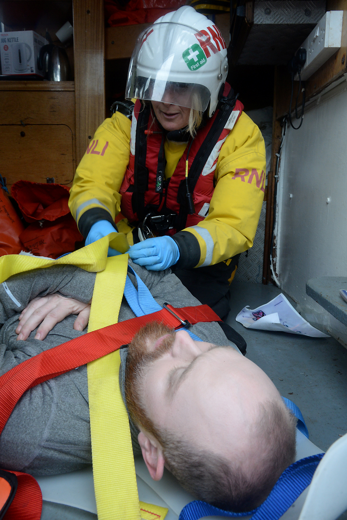 Crew Christina Bradley prepares casualty Joe Harvey and his simulated injuries for transfer to the lifeboat during the Whitstable RNLI Dan Davies Exercise. P