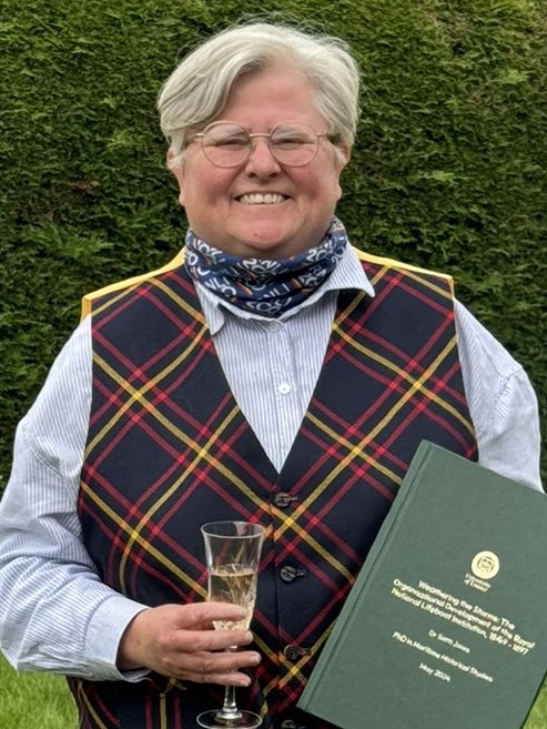Sam with her PhD thesis shortly after passing her viva