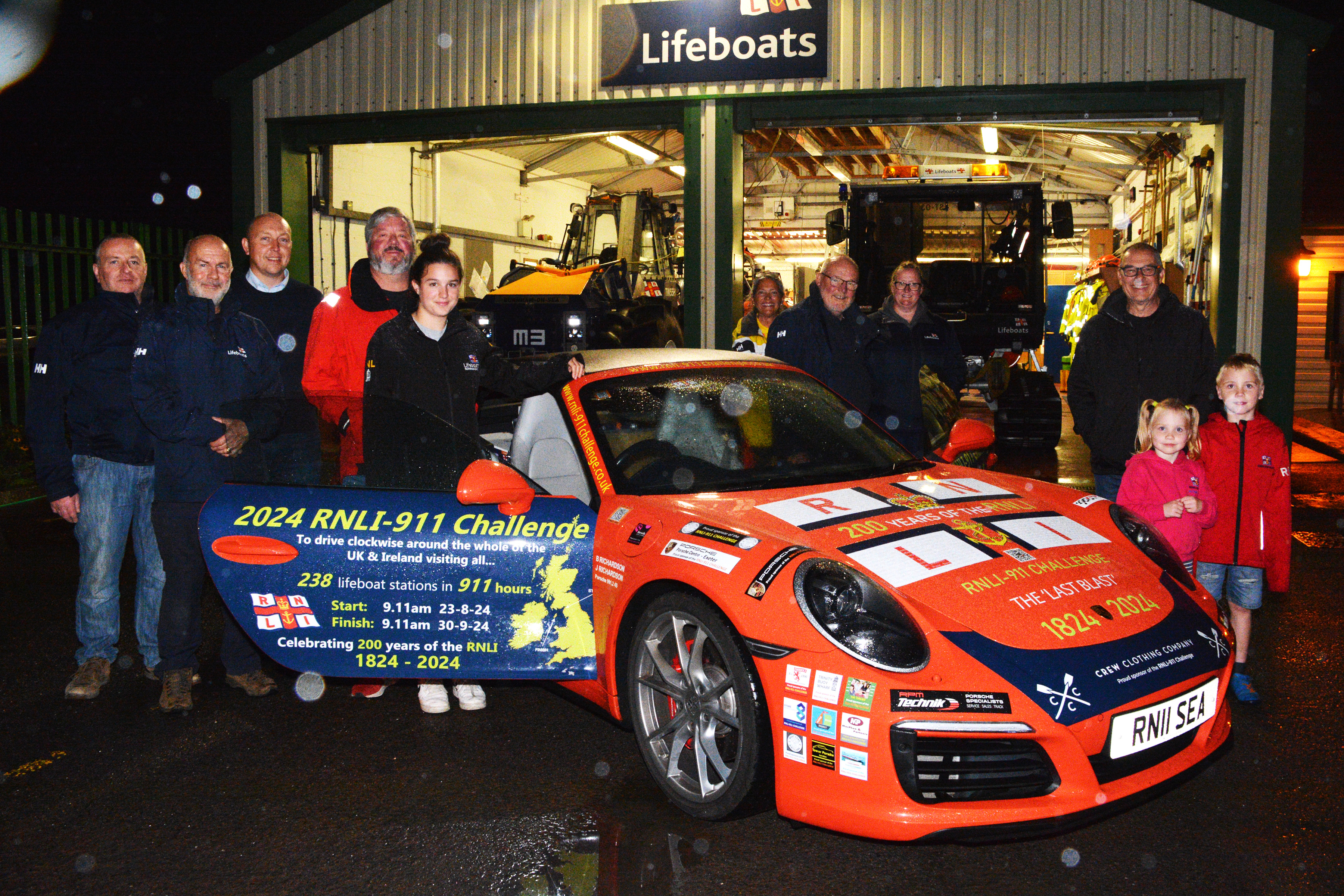 Burnham-on-Sea RNLI volunteers with the sponsored Porsche 911