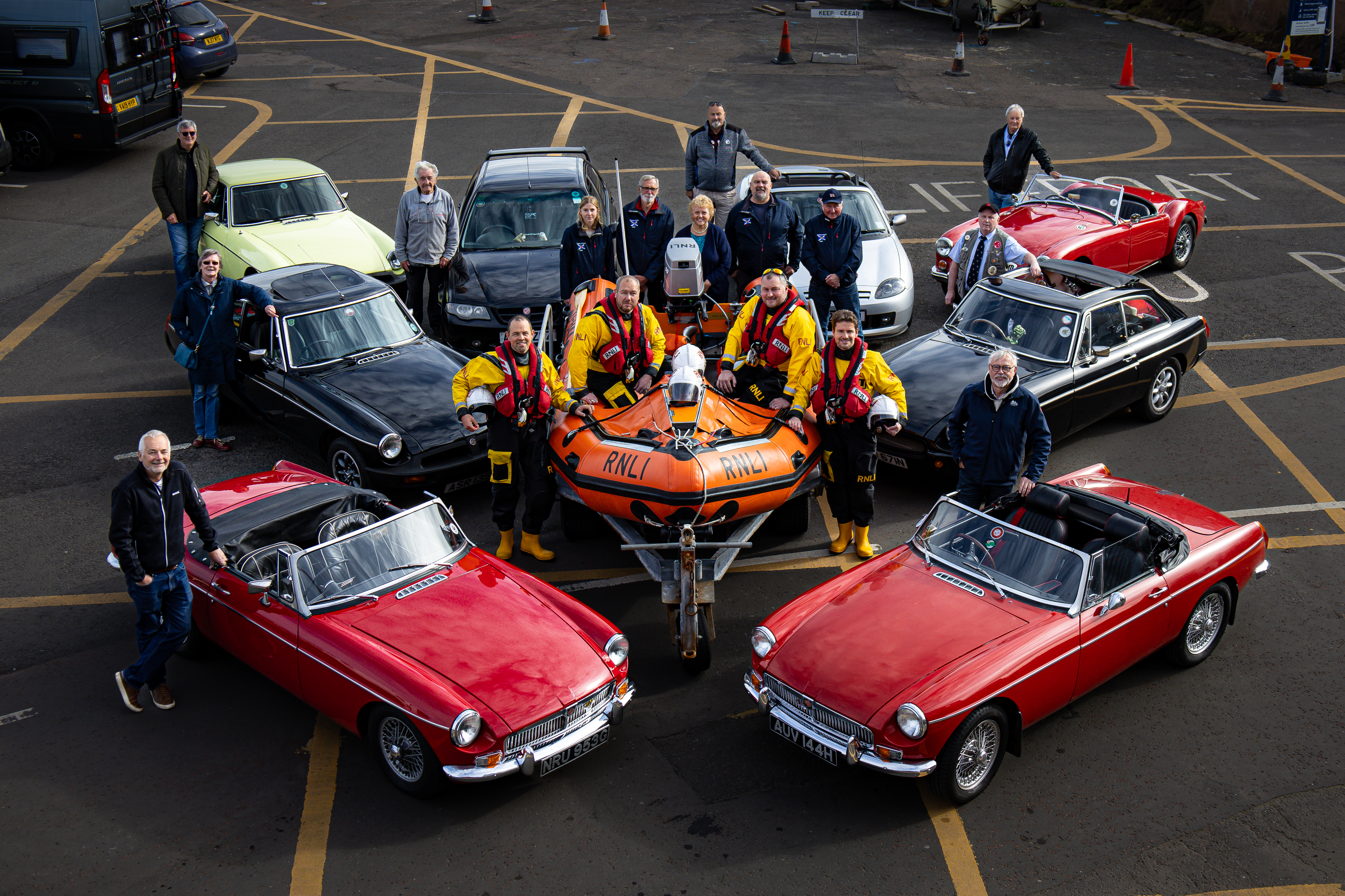 Eight cars and a lifeboat with crew and drivers.