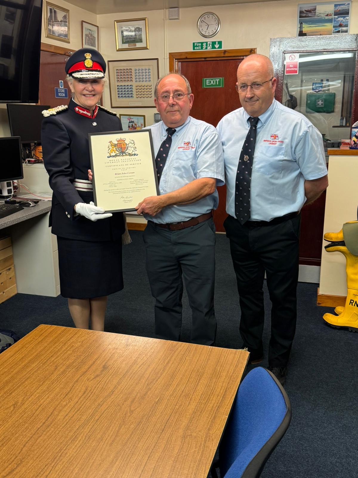 Lord Lieutenant of Northumberland Dr Caroline Pryer and Lifeboat operation manager Kevin Knox presemt Brian Cowan with Long service Award