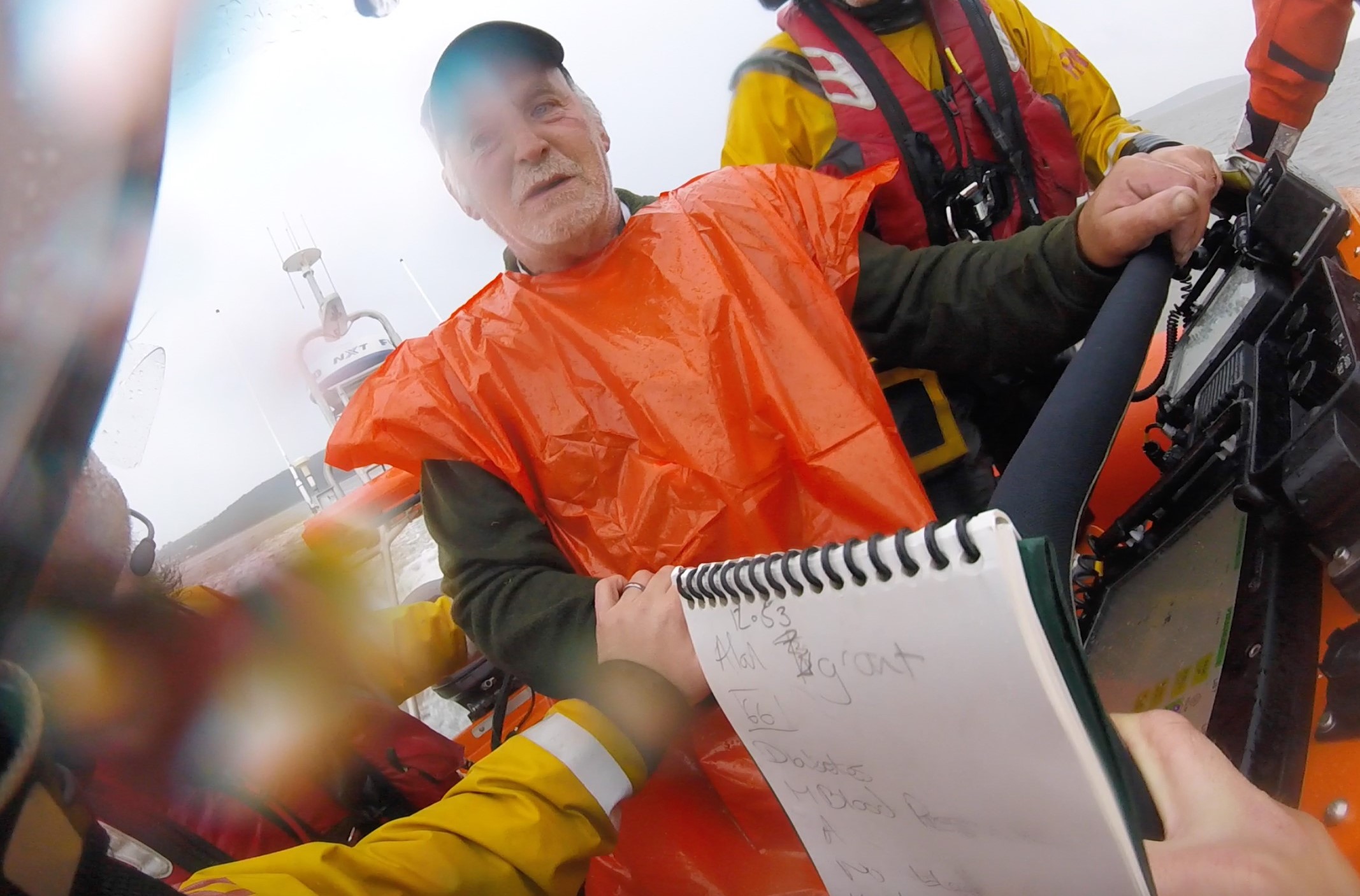 Allan Grant being reassured by RNLI volunteer crew on Atlantic 85 inshore lifeboat