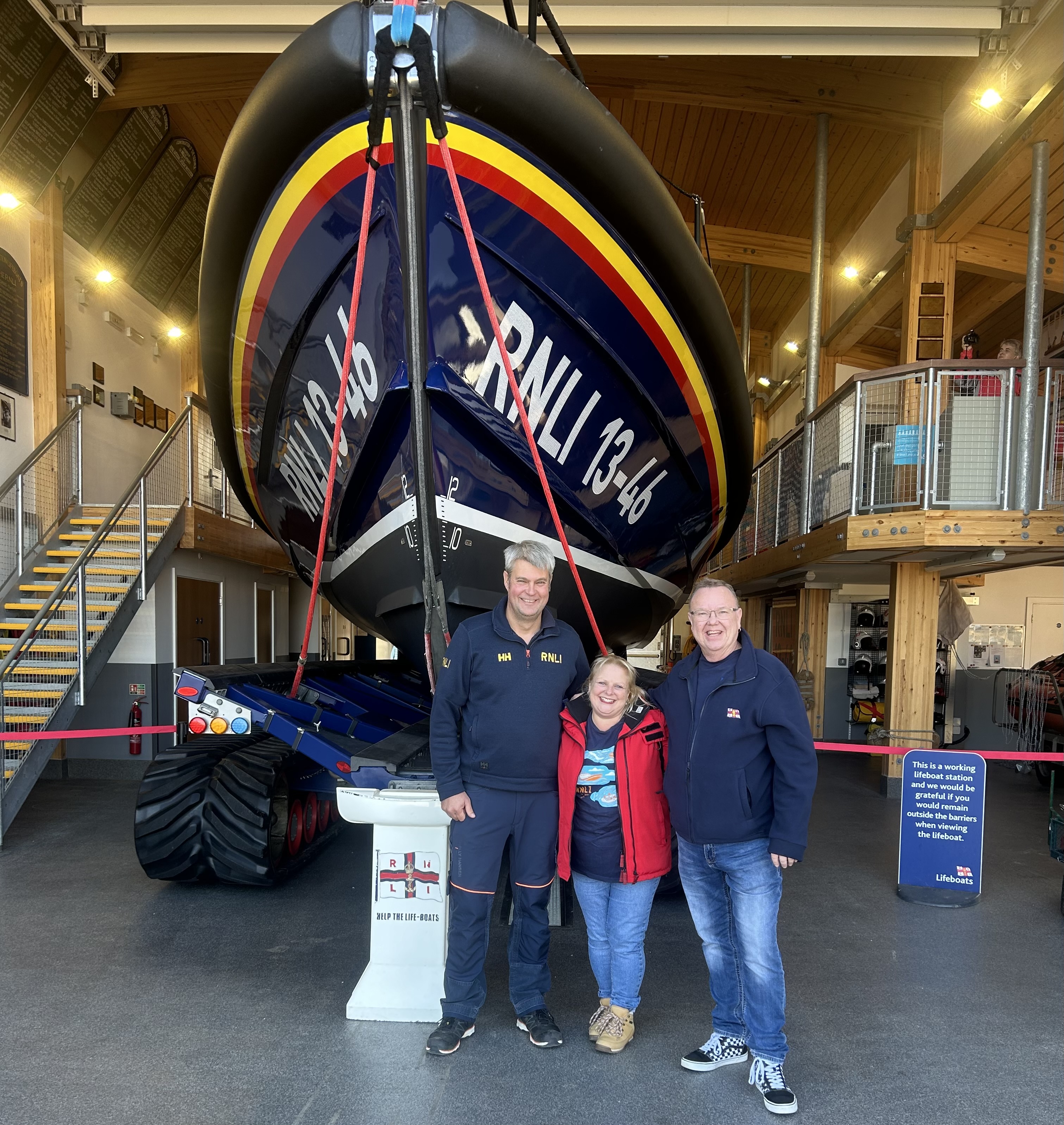 Julian and Debbie with Wells RNLI Mechanic Martin The visit marks the tour almost being at the finishing point in their challenge to visit 240 RNLI venues within a year. During each visit the couple leave 3 Betty’s 5p pots as a small donation for the station.
