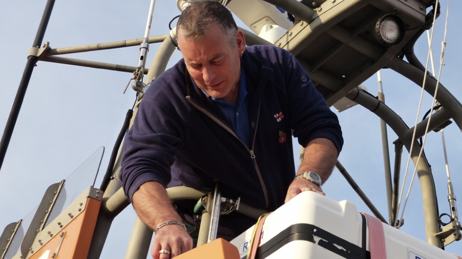 A man working on a lifeboat