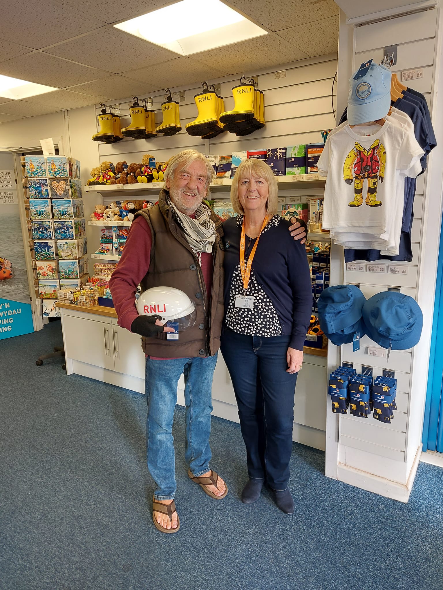 The photo shows Gavin and Stacey's Dick Powell, aka Gwynfor Roberts and RNLI shop volunteer Helen Bond in the RNLI shop