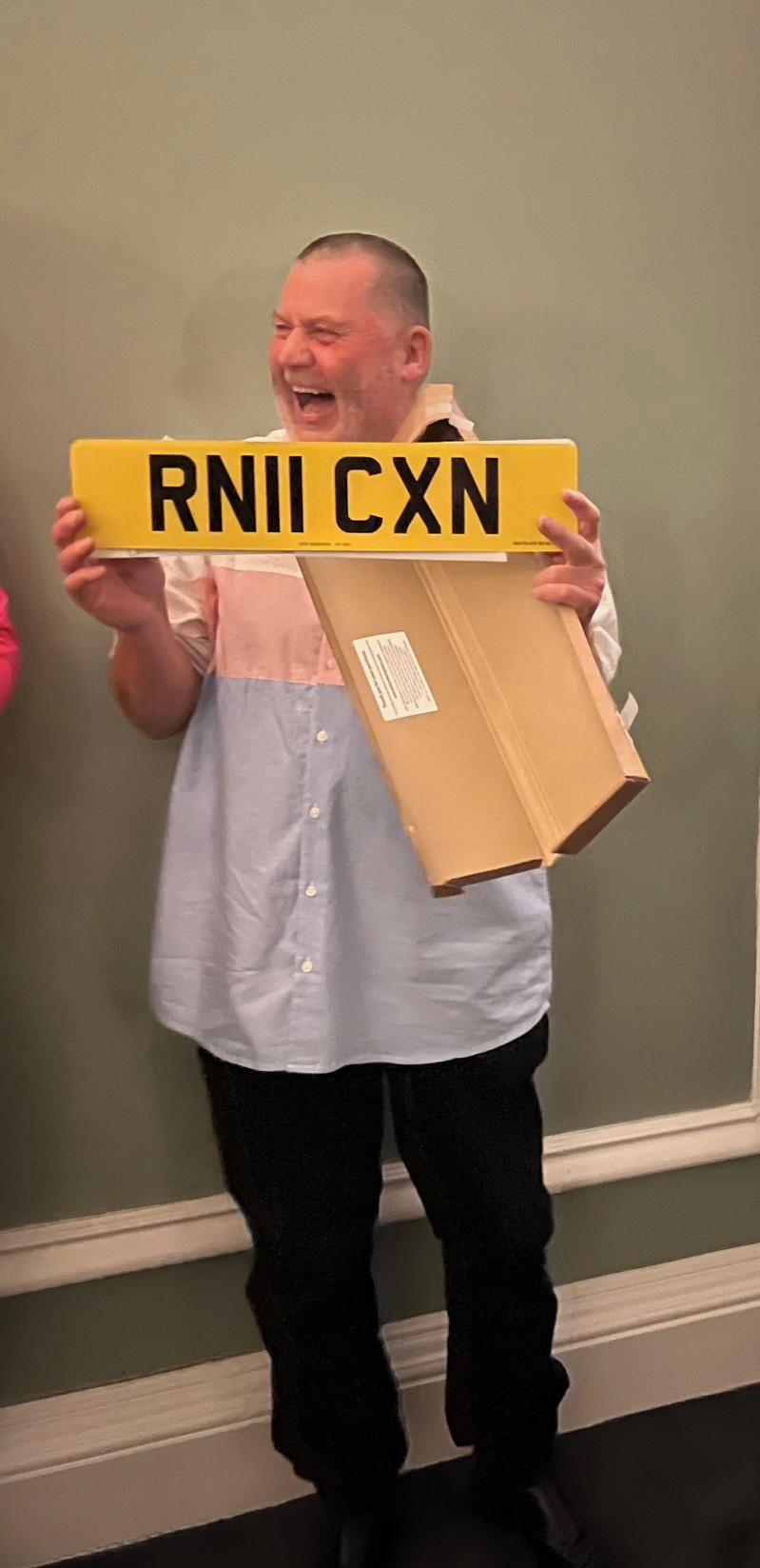 Robert McQueen with license plate presented by Portpatrick RNLI crew