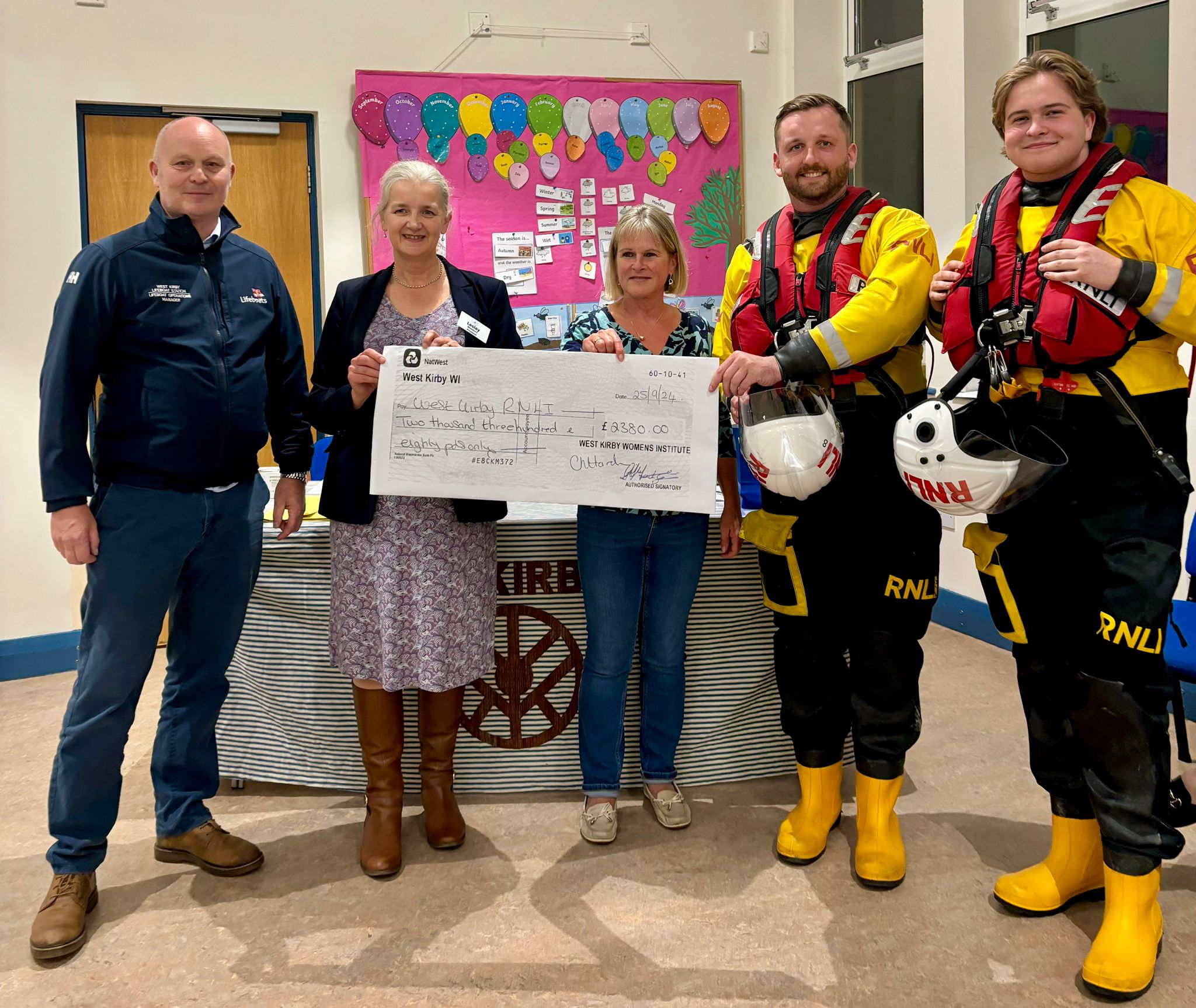 The attached picture shows Richard Diamond, Lifeboat Operations Manager at West Kirby RNLI; Lesley Dewsbury, President of West Kirby WI; sub-committee member Helen Lee; and West Kirby Lifeboat crew members Will Jones and Ben Shoebridge. Credit: Eve Kemp