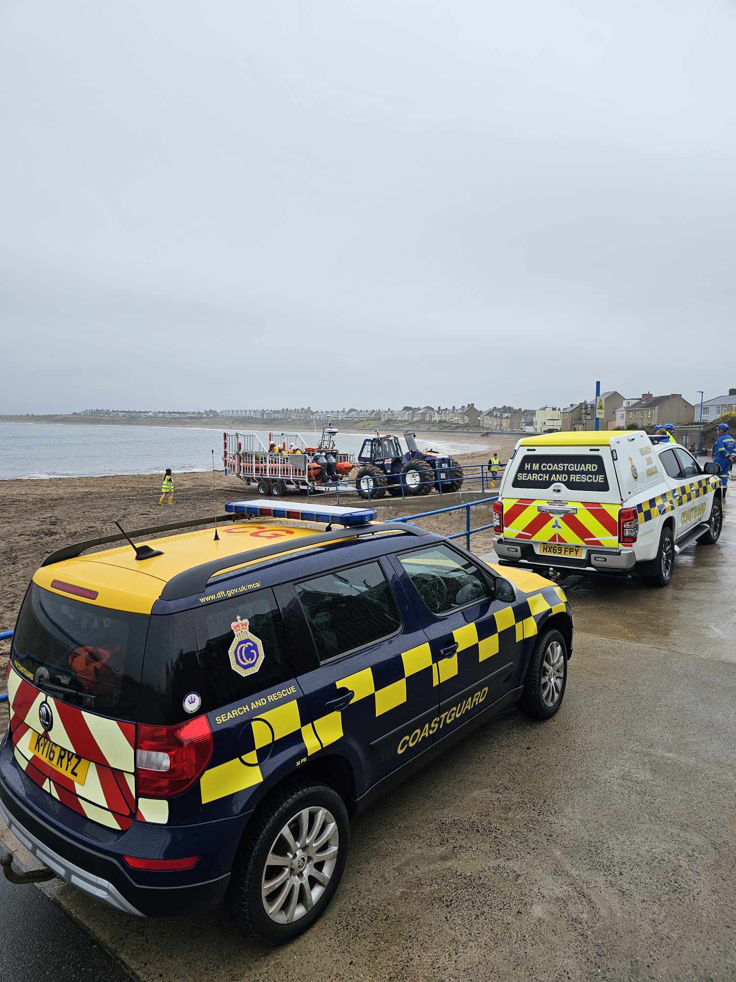 Lifeboat and coastguard teams after lifeboat landed
