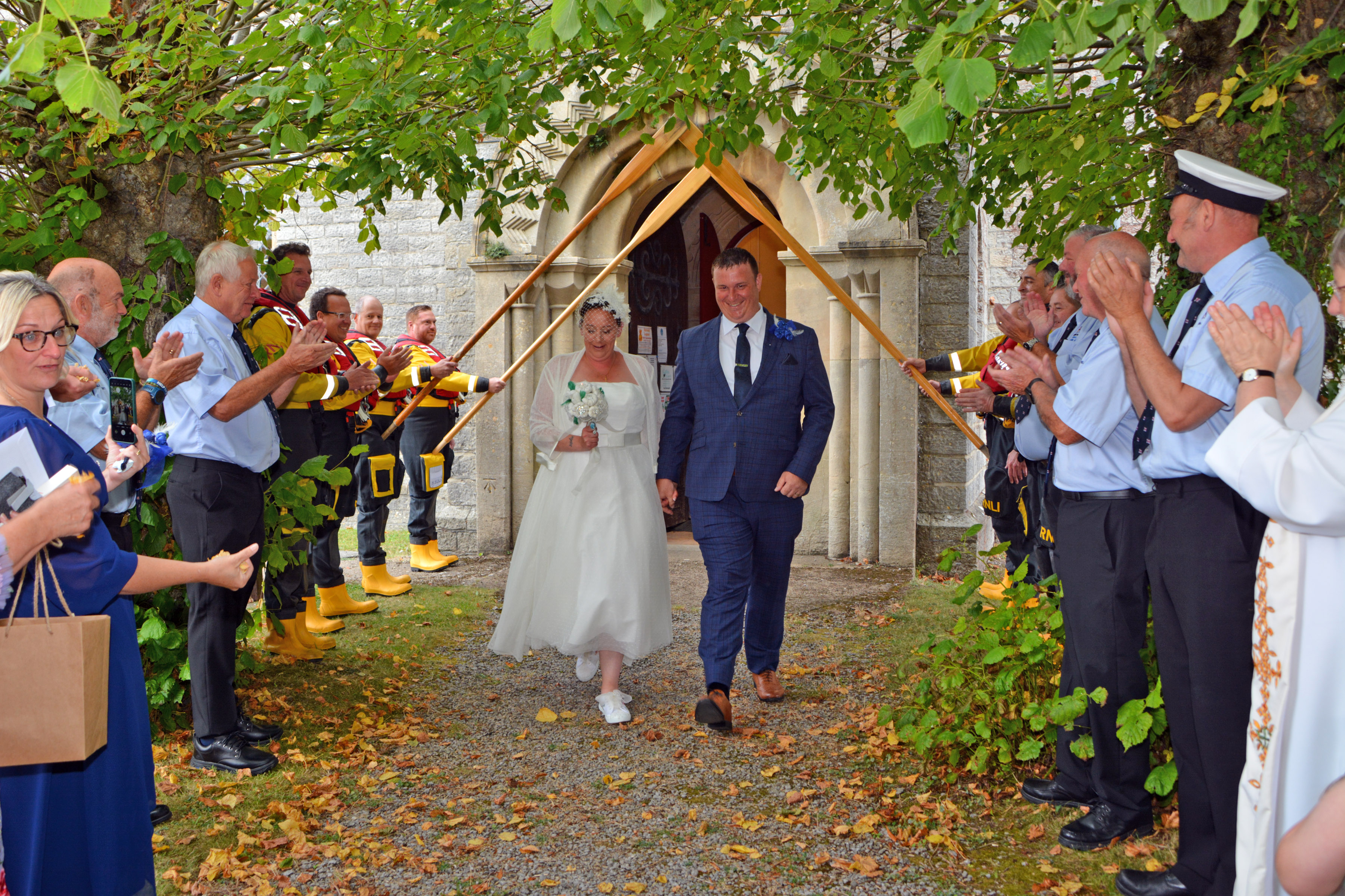 Matt and Abbey leaving the church through the guard of honour
