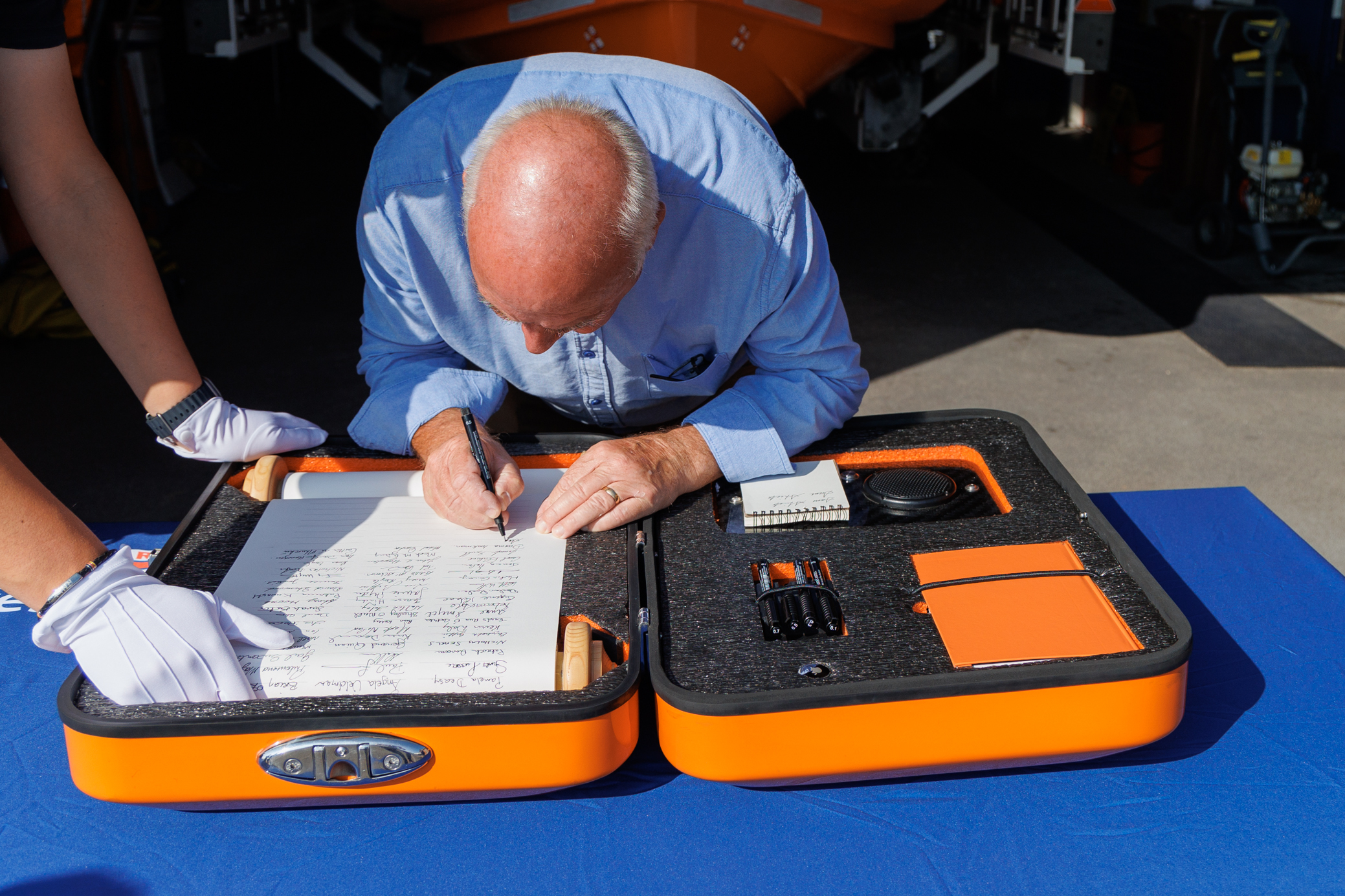 Sam Shiels signing the scroll