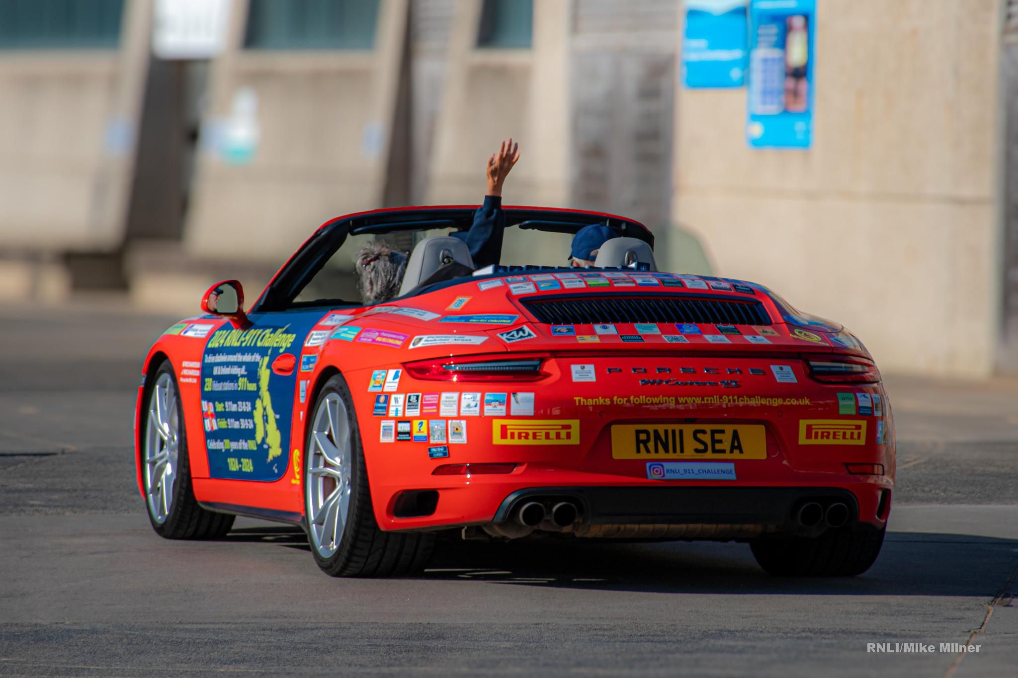 Belinda and James depart in their Porsche 911 'Splash'.