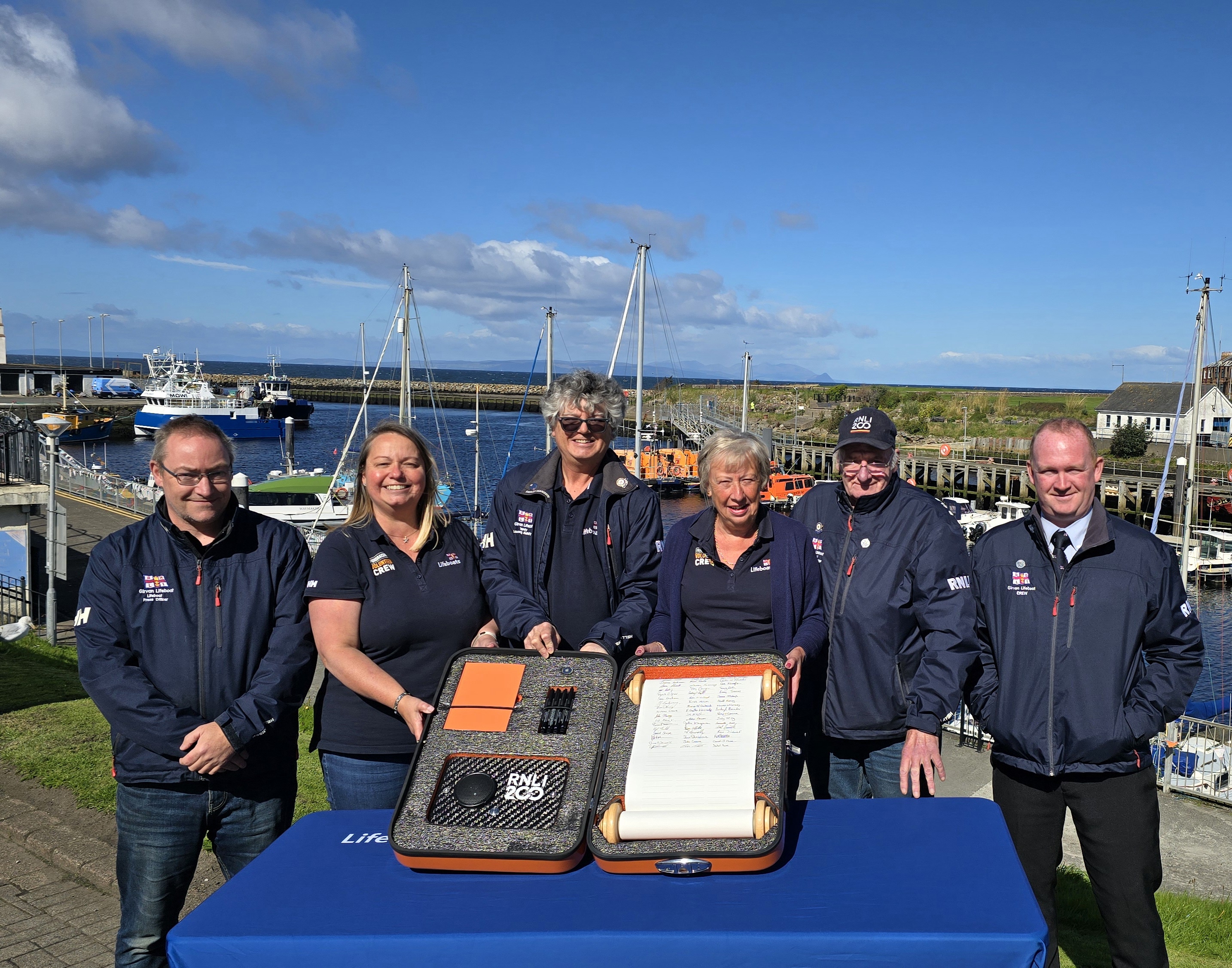 Girvan RNLI volunteers with RNLI 200 Scroll