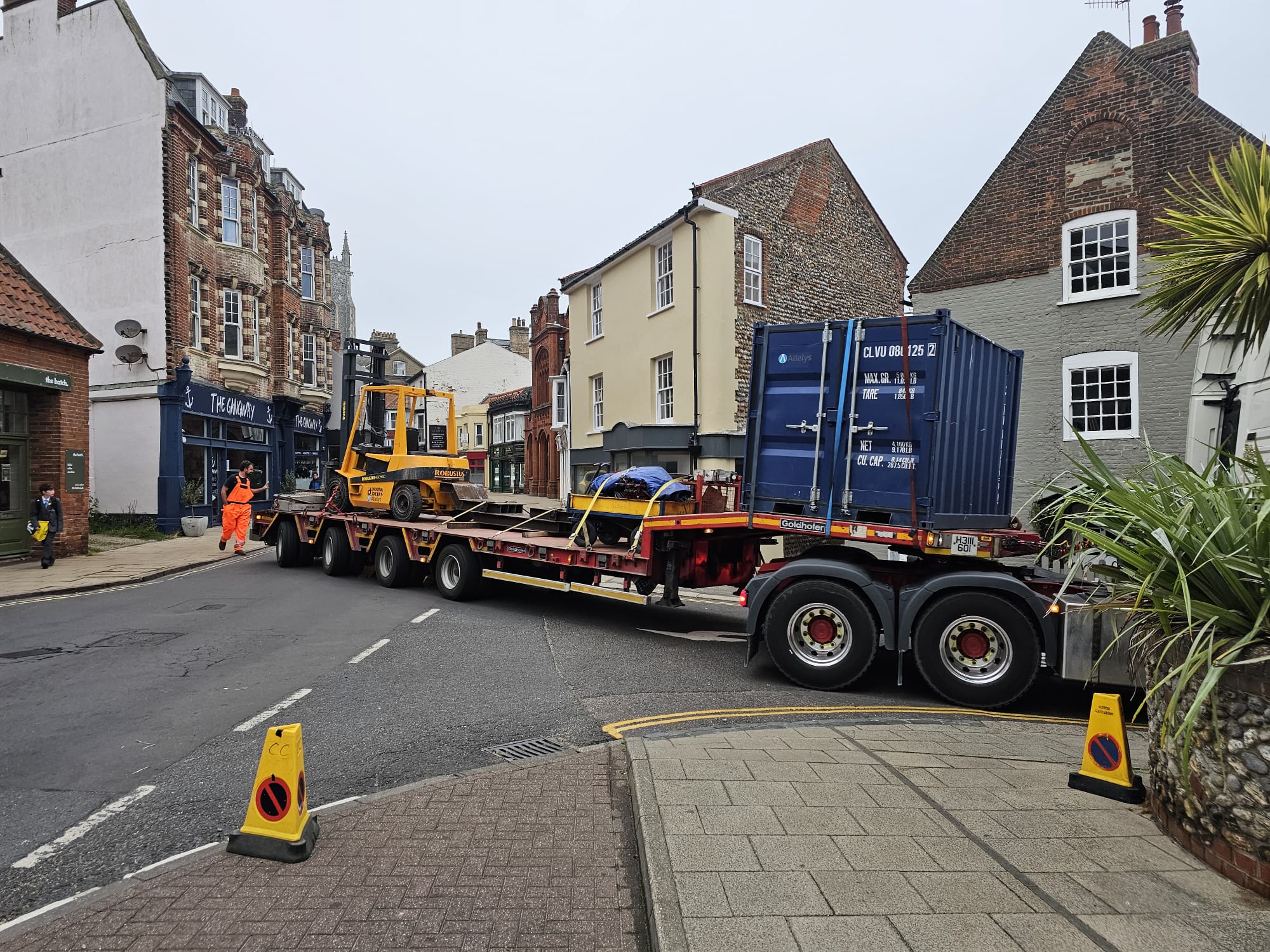 Specialist movers arrive at the RNLI Henry Blogg Museum in Cromer. A low loader is carefully guided through a narrow street in Cromer taking lifting gear and other specialist equipment ready for moving the historic lifeboat