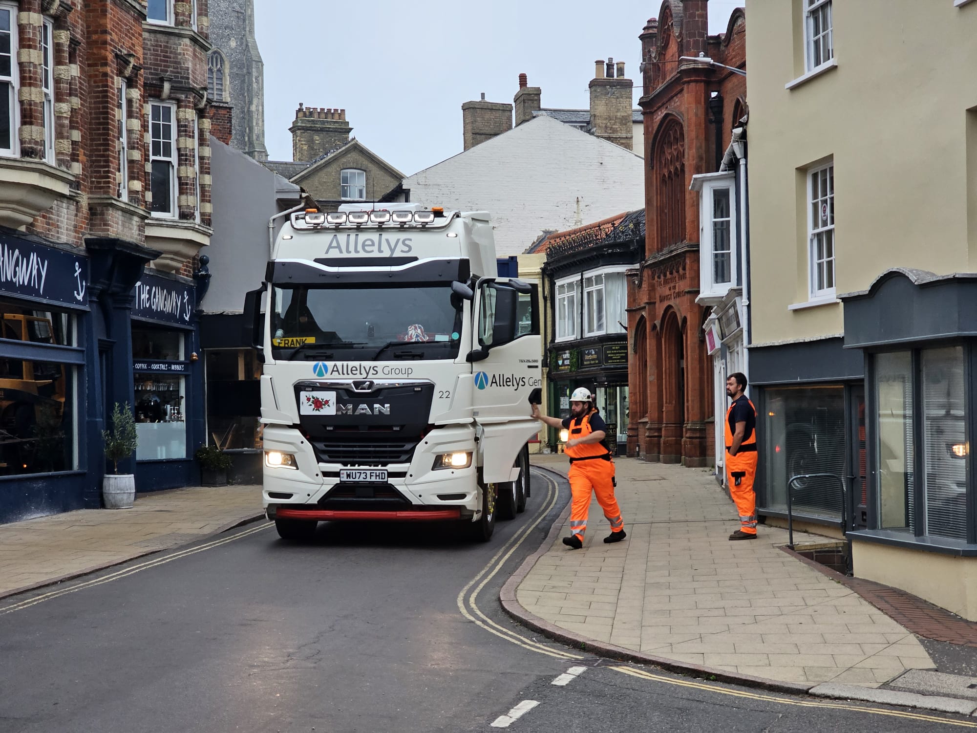 Specialist movers arrive at the RNLI Henry Blogg Museum in Cromer. A low loader is carefully guided through a narrow street in Cromer taking lifting gear and other specialist equipment ready for moving the historic lifeboat