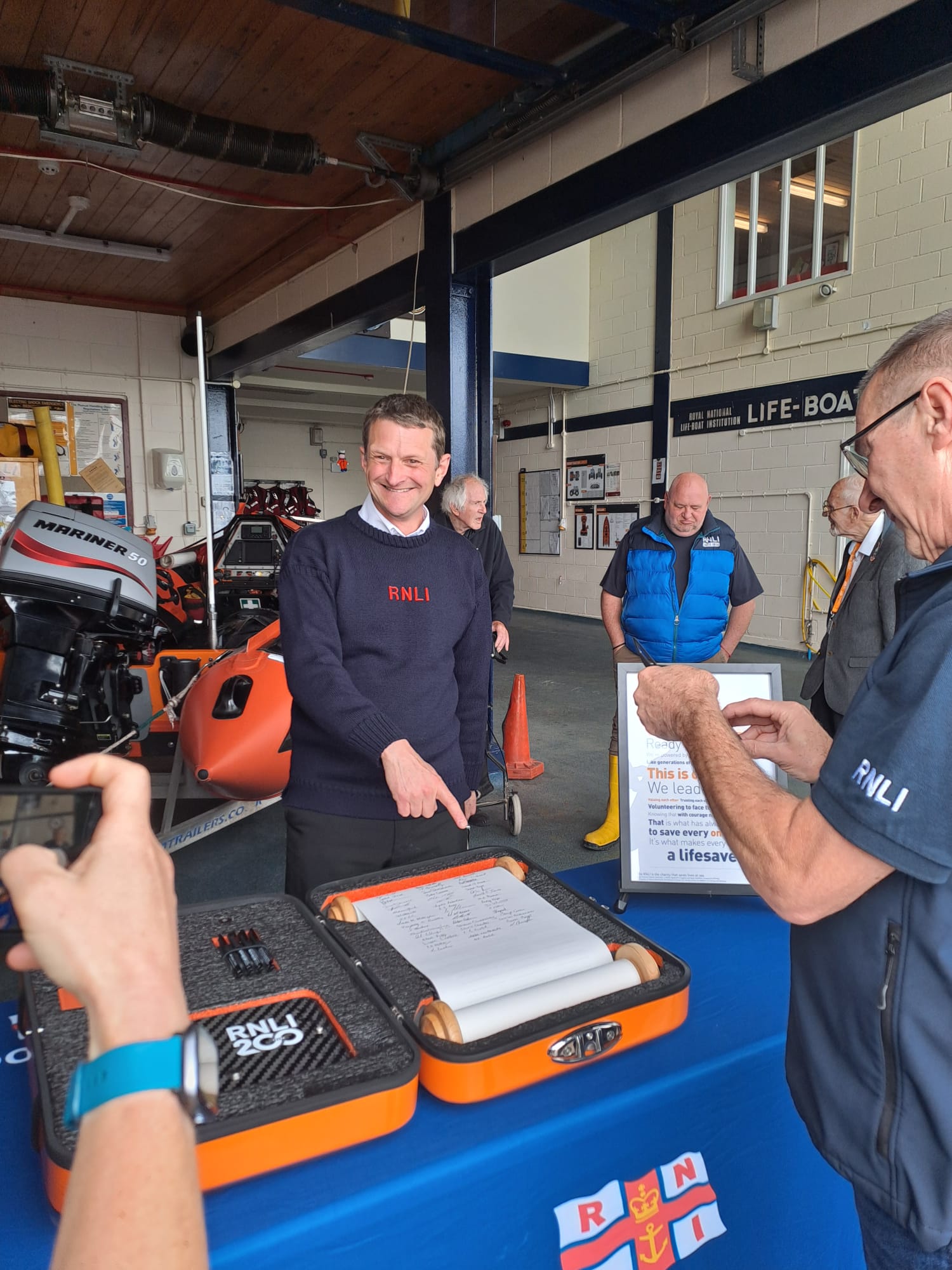 Jim Mayer rep for Crew at Penarth signing the Scroll
