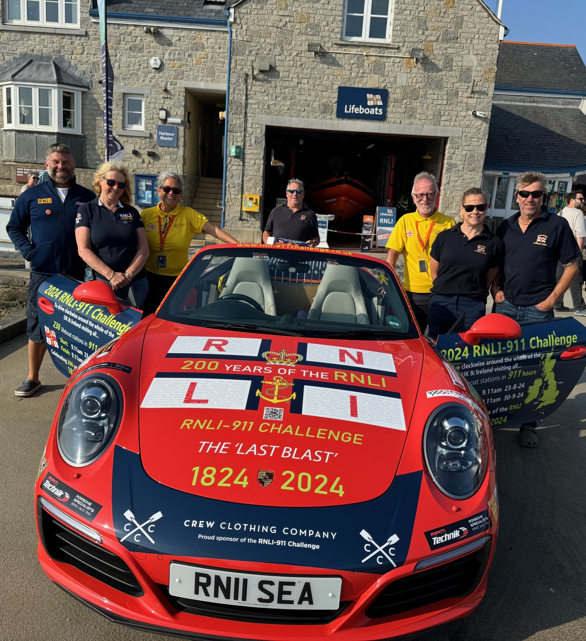 car on slipway with crew
