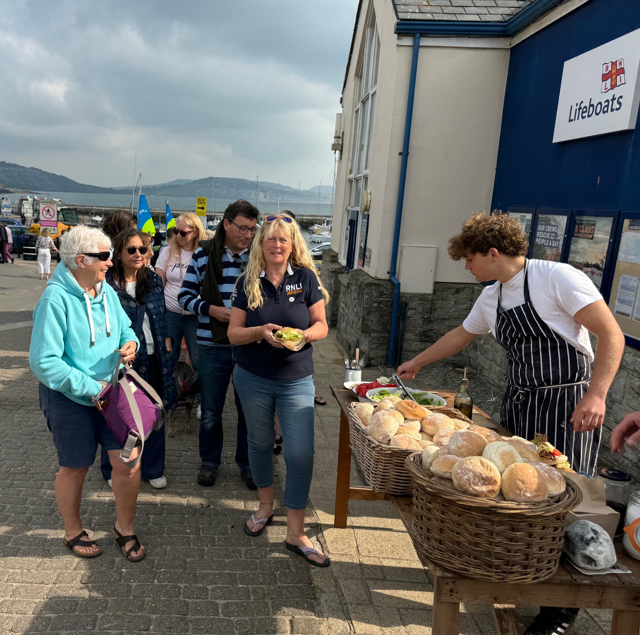Queue of people outside Lyme Regis lifeboat station