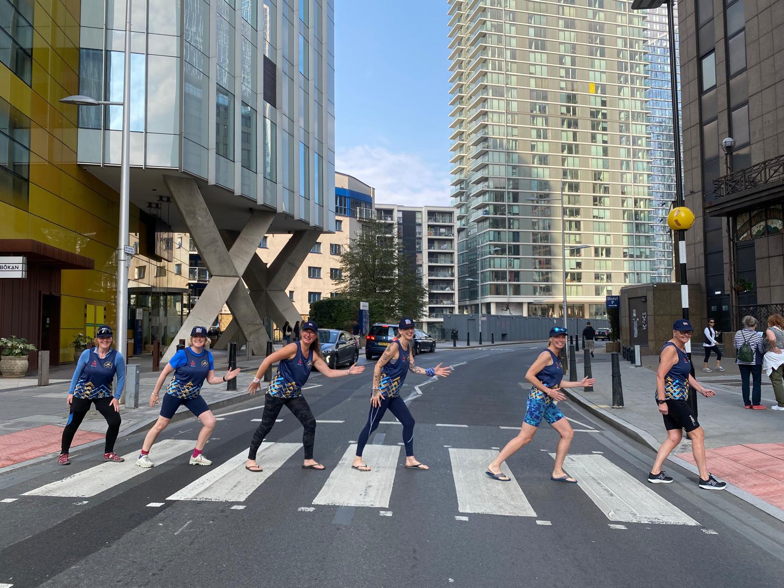 The crew walking across a zebra crossing in London 