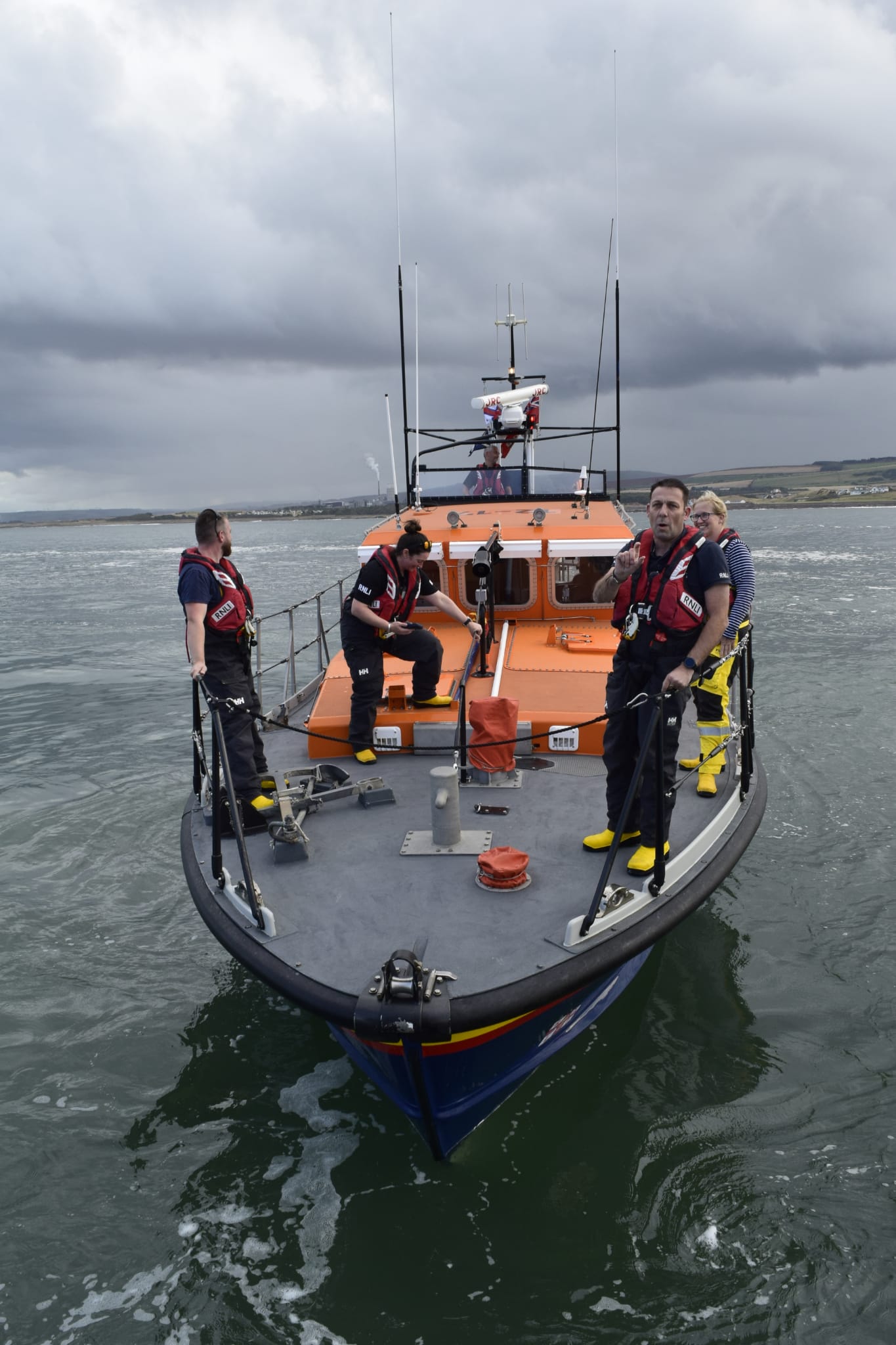 Four crew on boat.