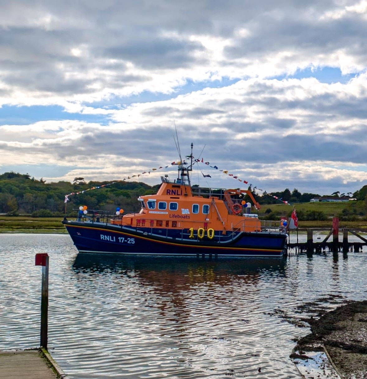 Yarmouth Severn class lifeboat Eric and Susan Hiscock (Wanderer) 17-25 decorated for the occasion outside the Yarmouth Sailing Club.