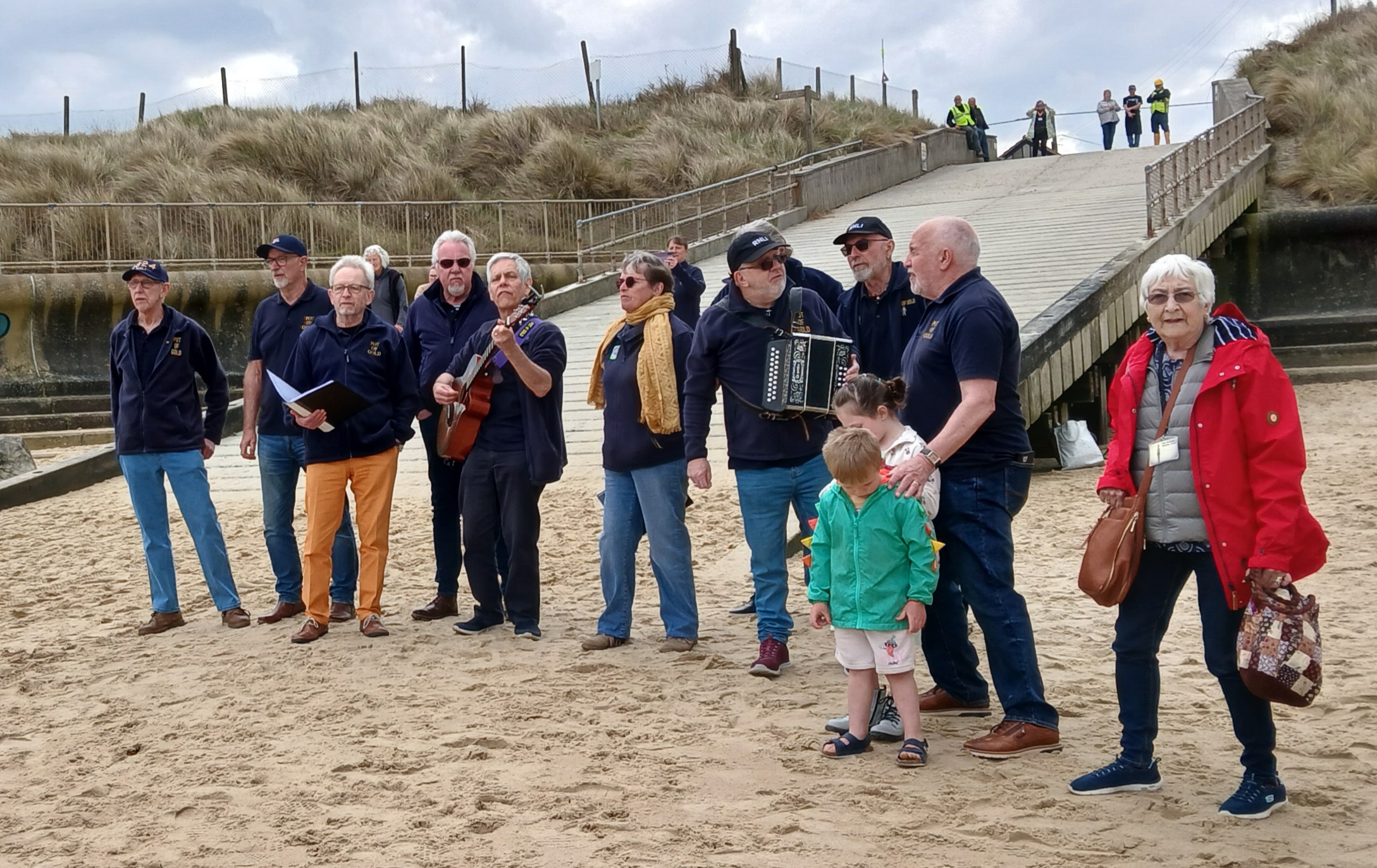 Pot of Gold Shanty Crew sing on Beach as Lifeboat Did Display