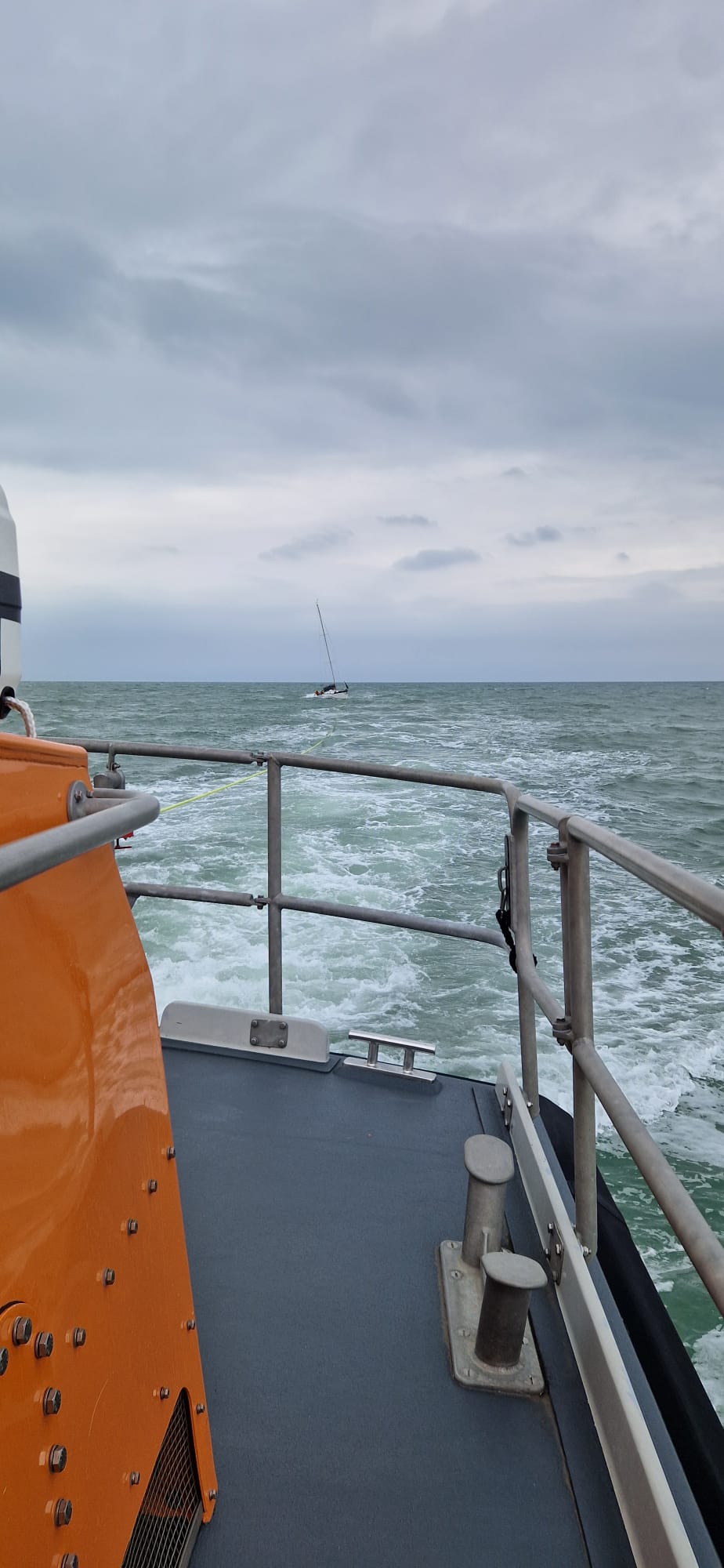Newhaven lifeboat towing the casualty yacht