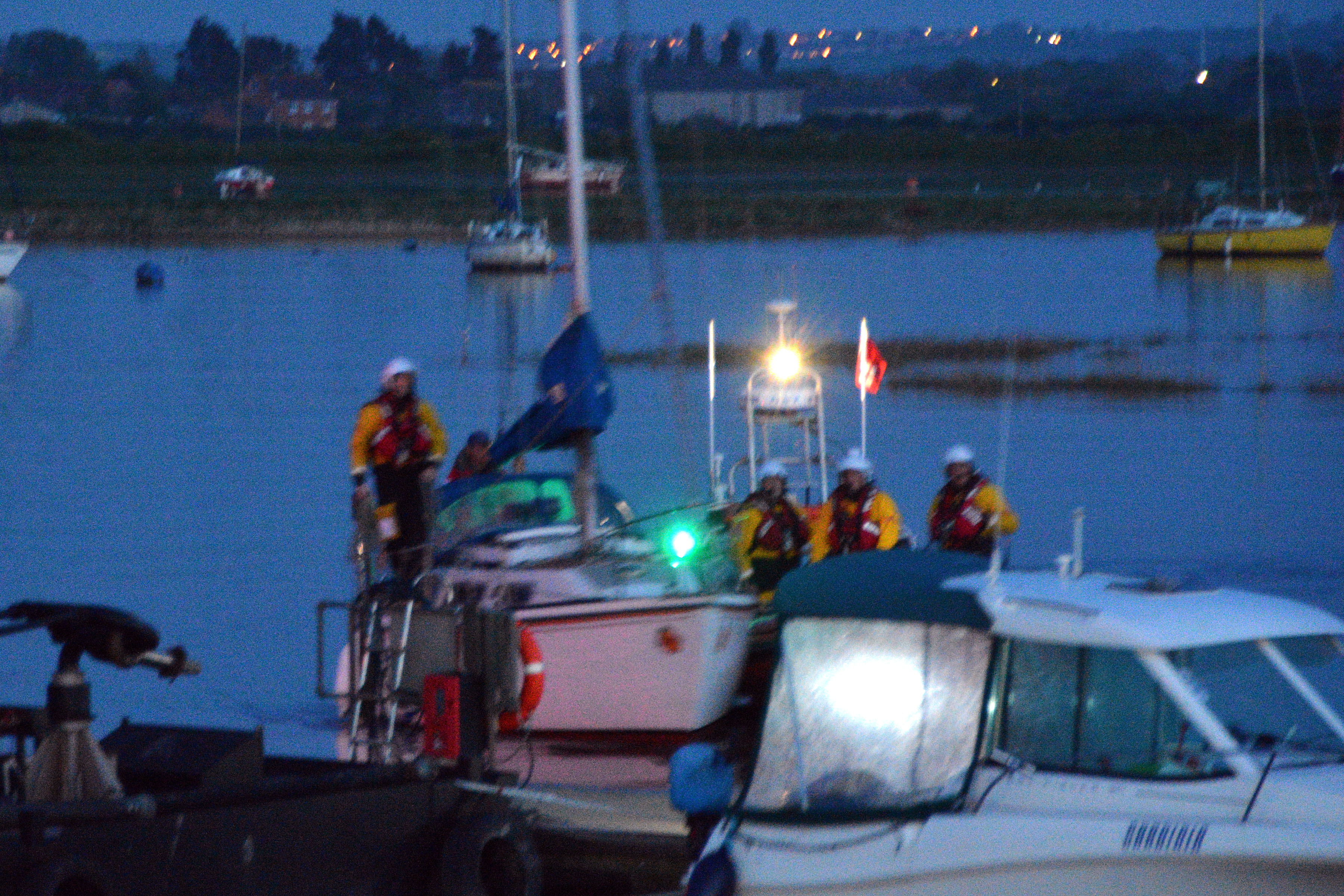 The yacht being moored at the sailing club