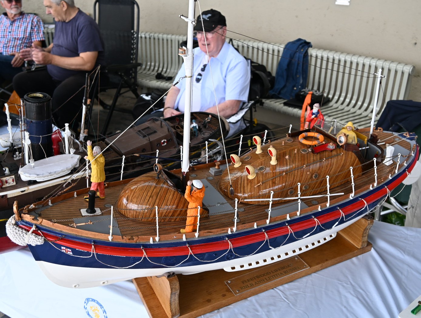 Model of lifeboat with man sat behind