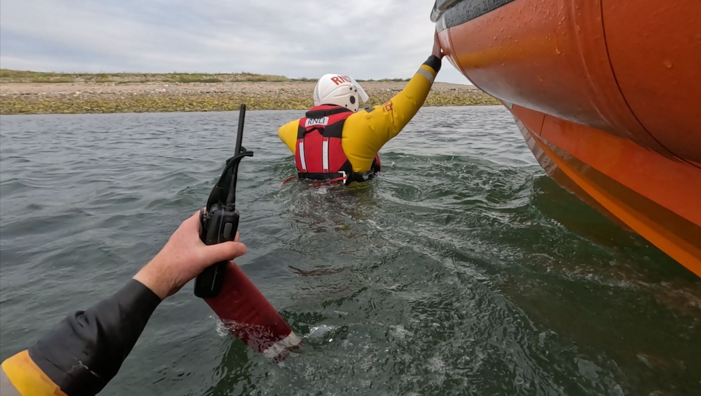 Skerries RNLI volunteers making their way ashore