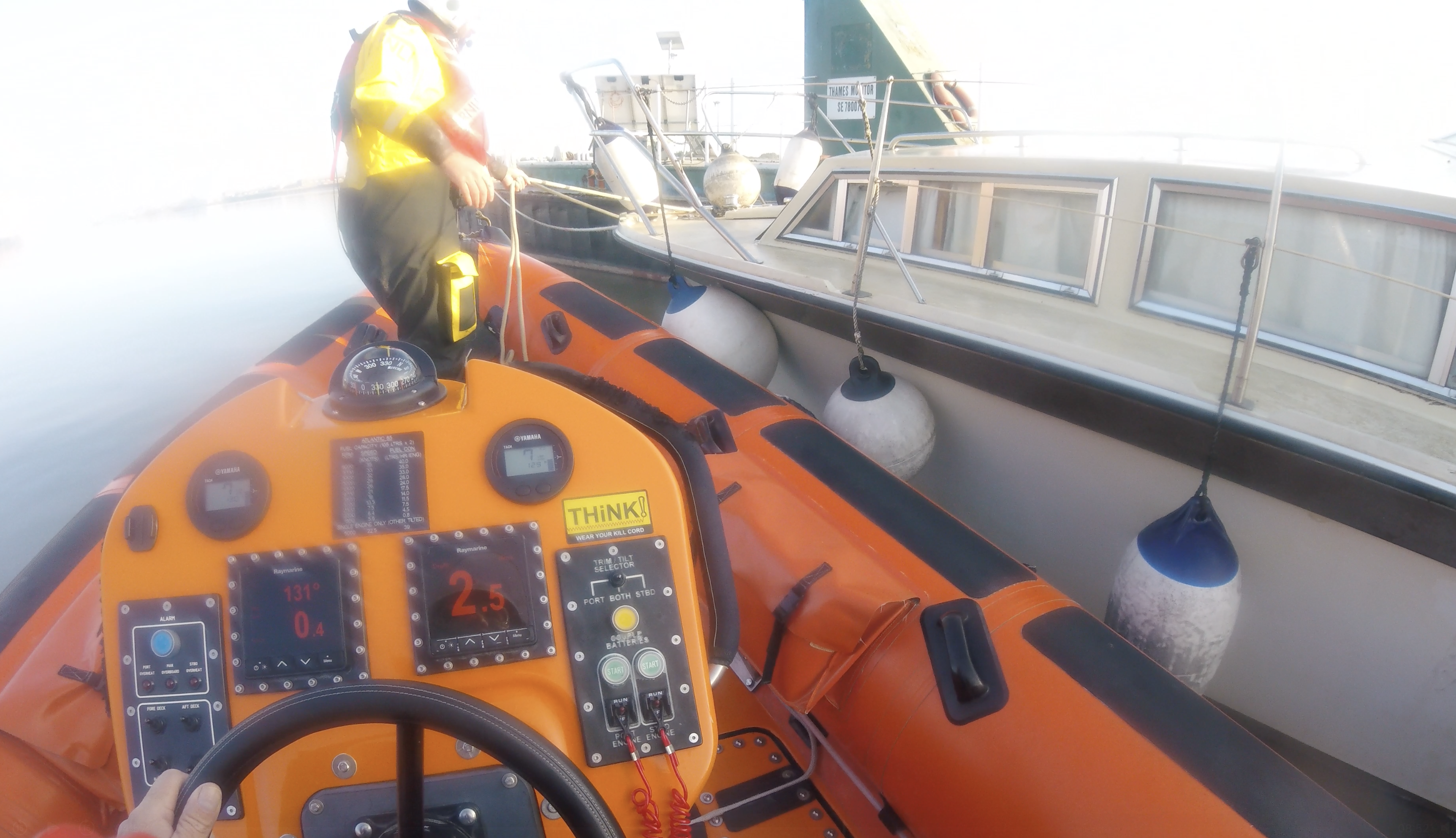 Gravesend's orange Lifeboat is next to the white casualty vessel setting up secure lines