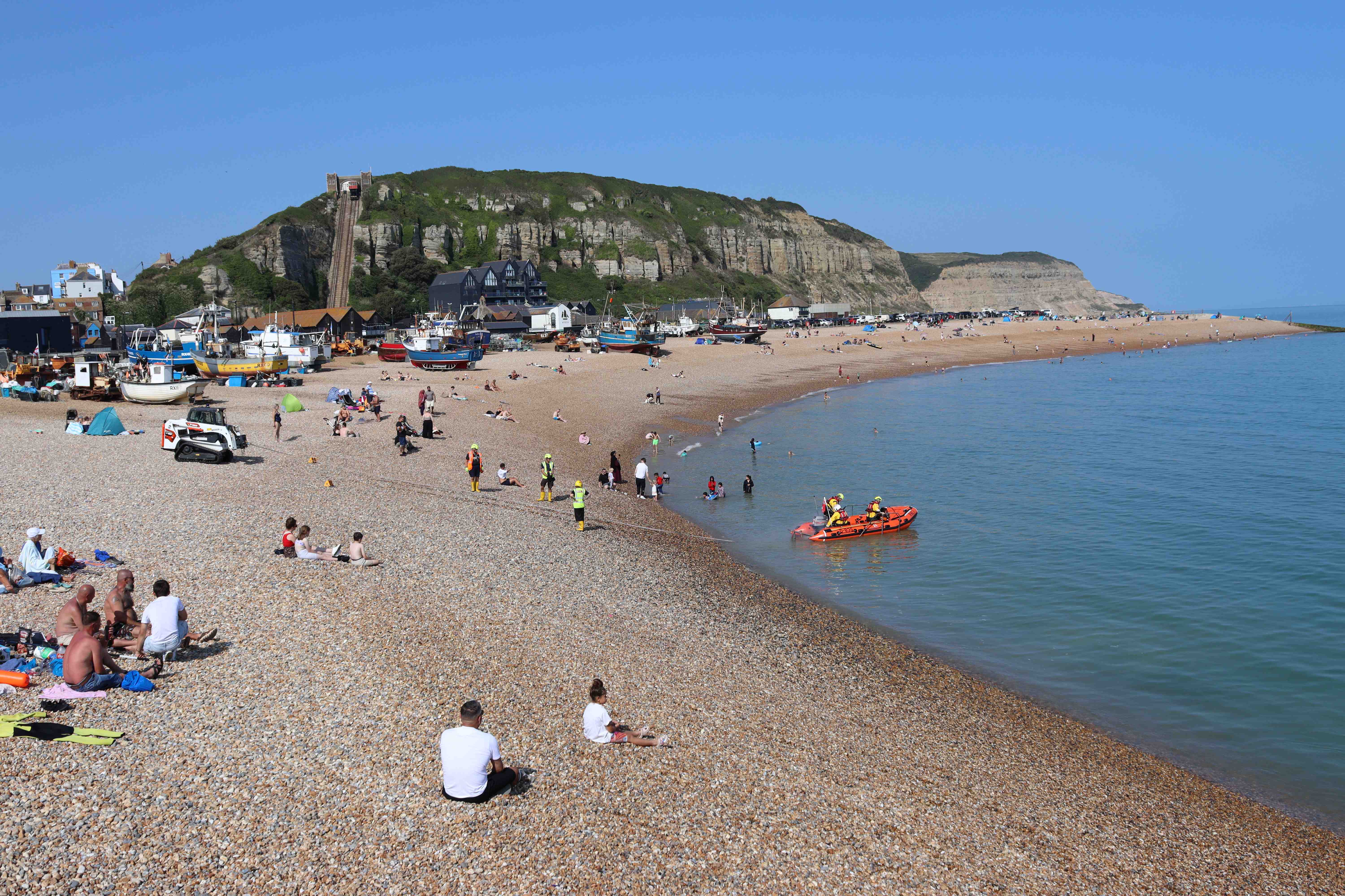 Hastings inshore lifeboat enters the sea at Hastings' fishing beach, the Stade