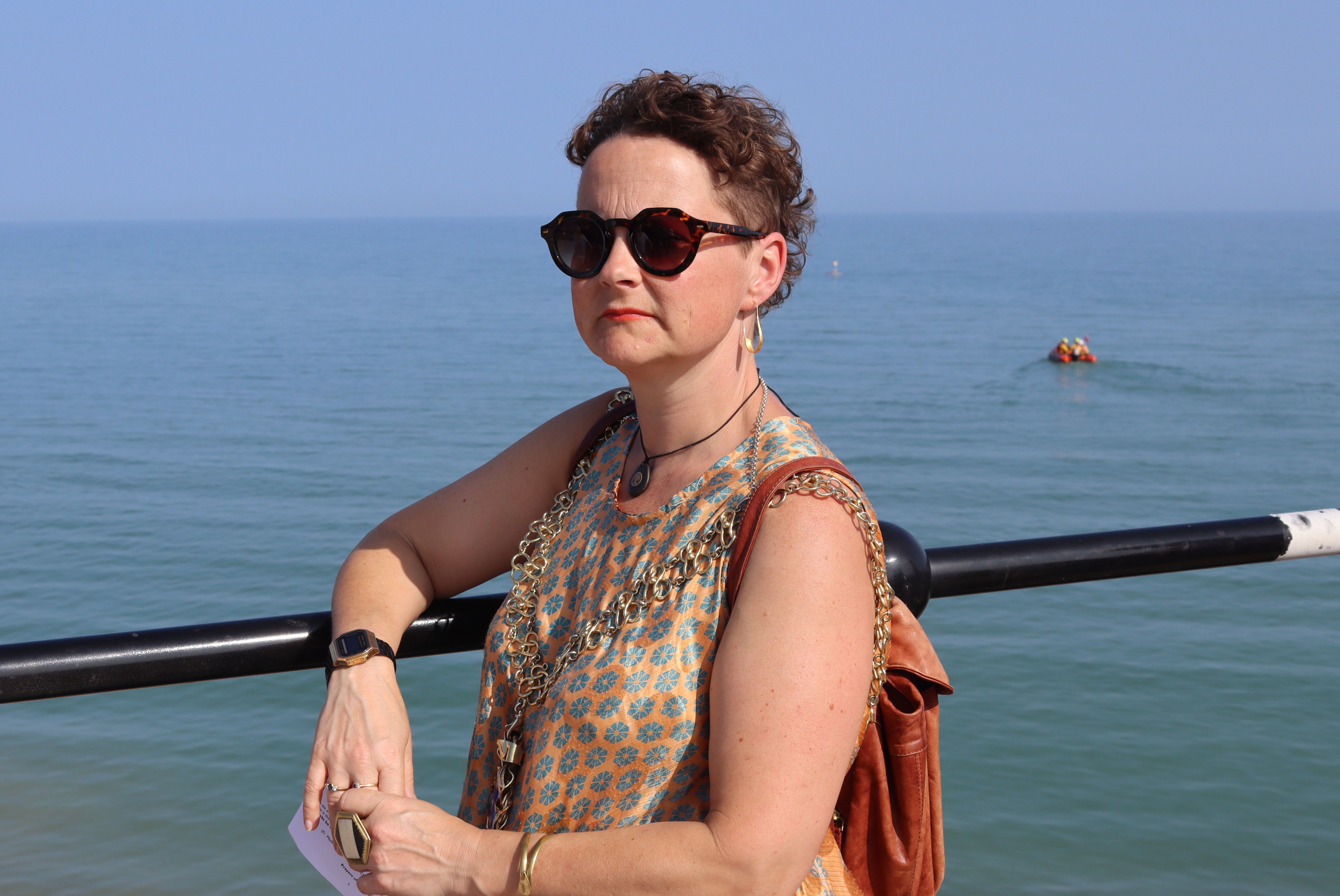 Mayor of Hastings Cllr Becca Horn on the harbour arm with Hastings inshore lifeboat in background