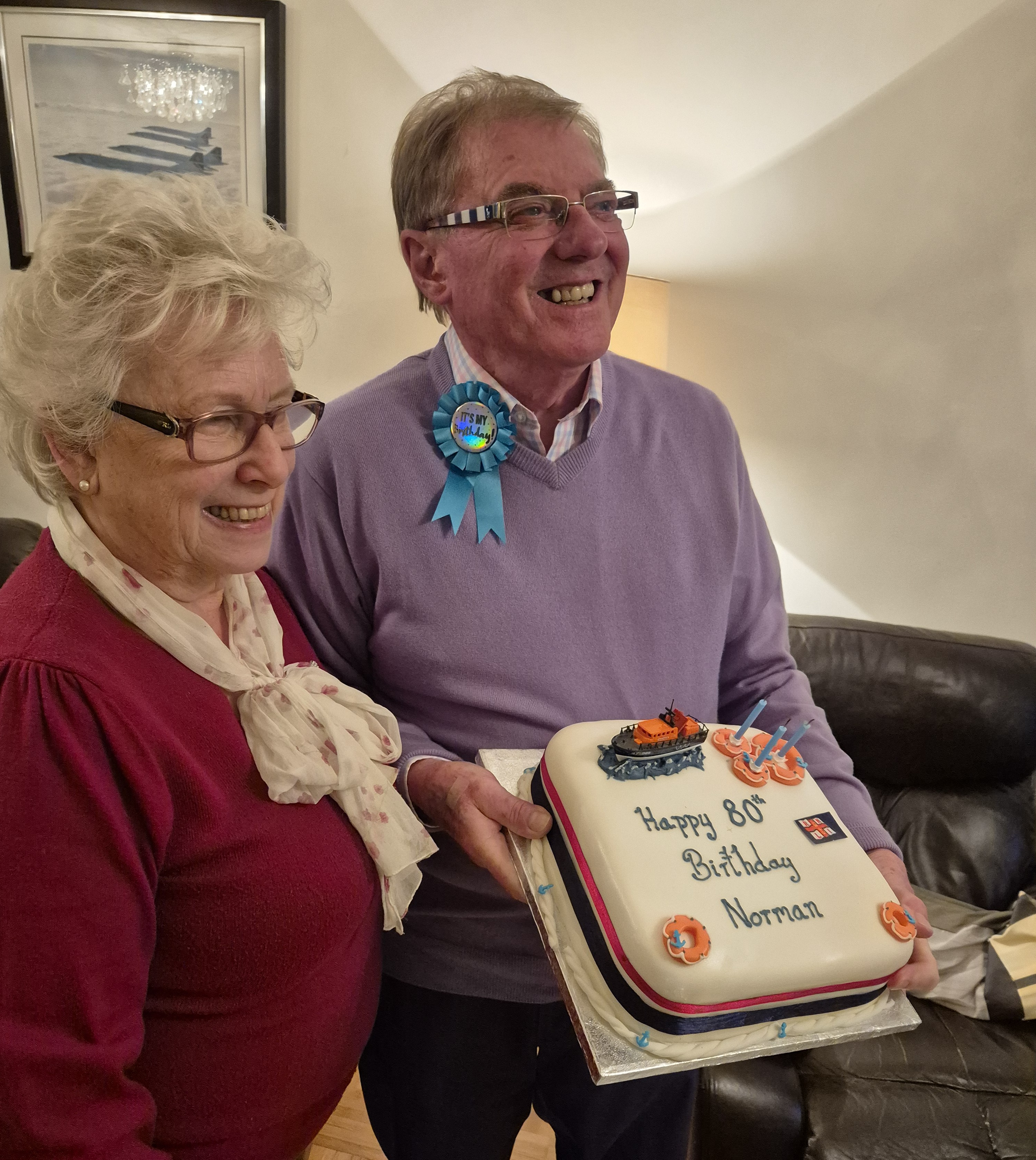 Norman and Sally Daniells with his lifeboat themed birthday cake 