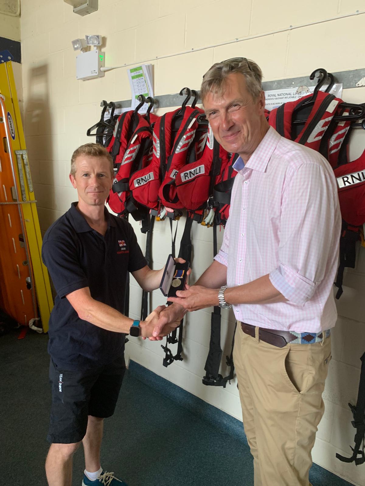 Owain receiving his award for 22 years service from Peter Sparkes CEO