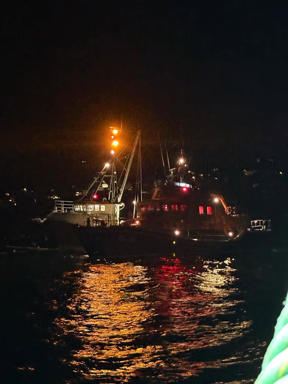 Picture shows a lifeboat alongside a fishing vessel