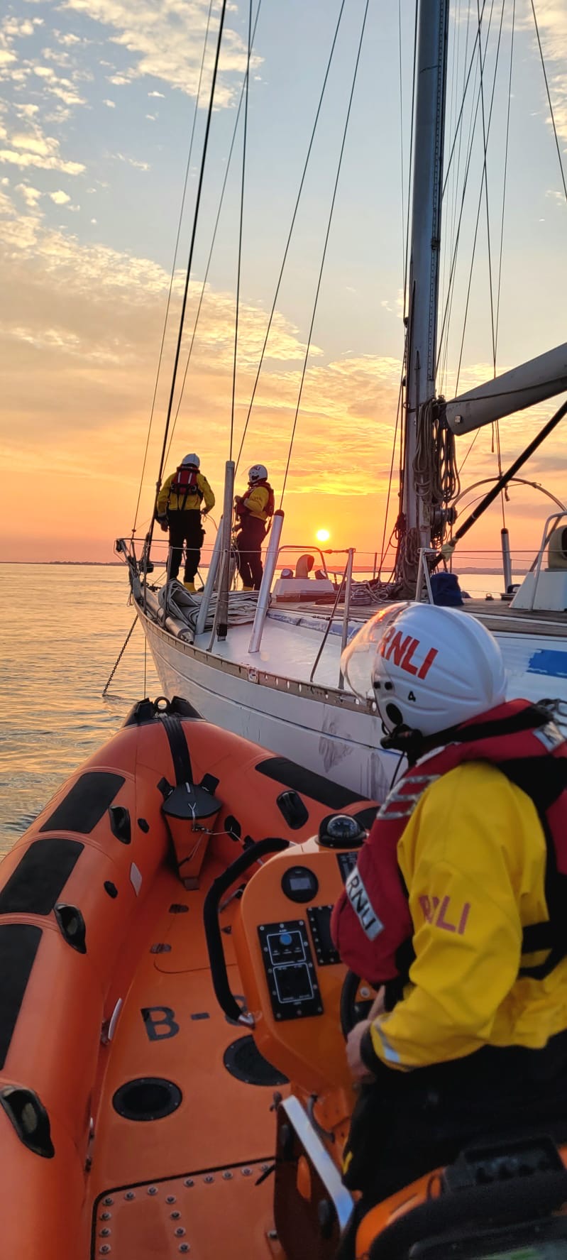 Lymington crew helping secure drifting yachts anchor