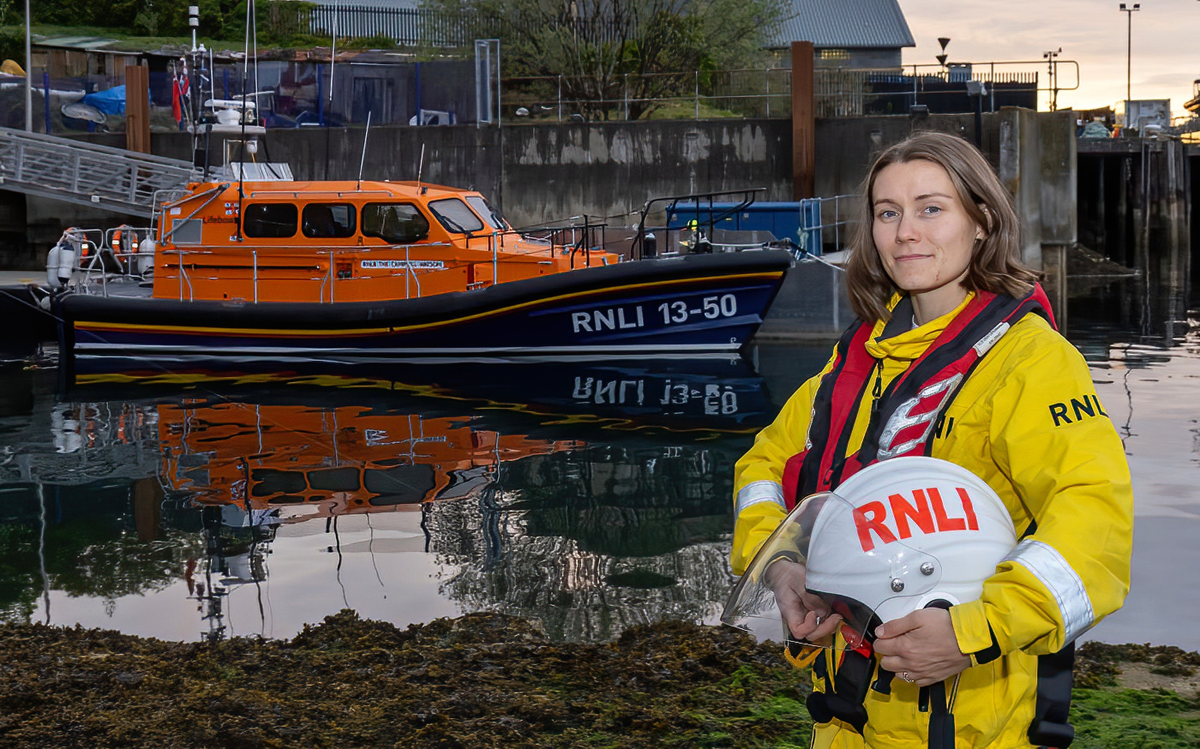 Jasmin standing in full seagoing kit in front of the Oban lifeboat