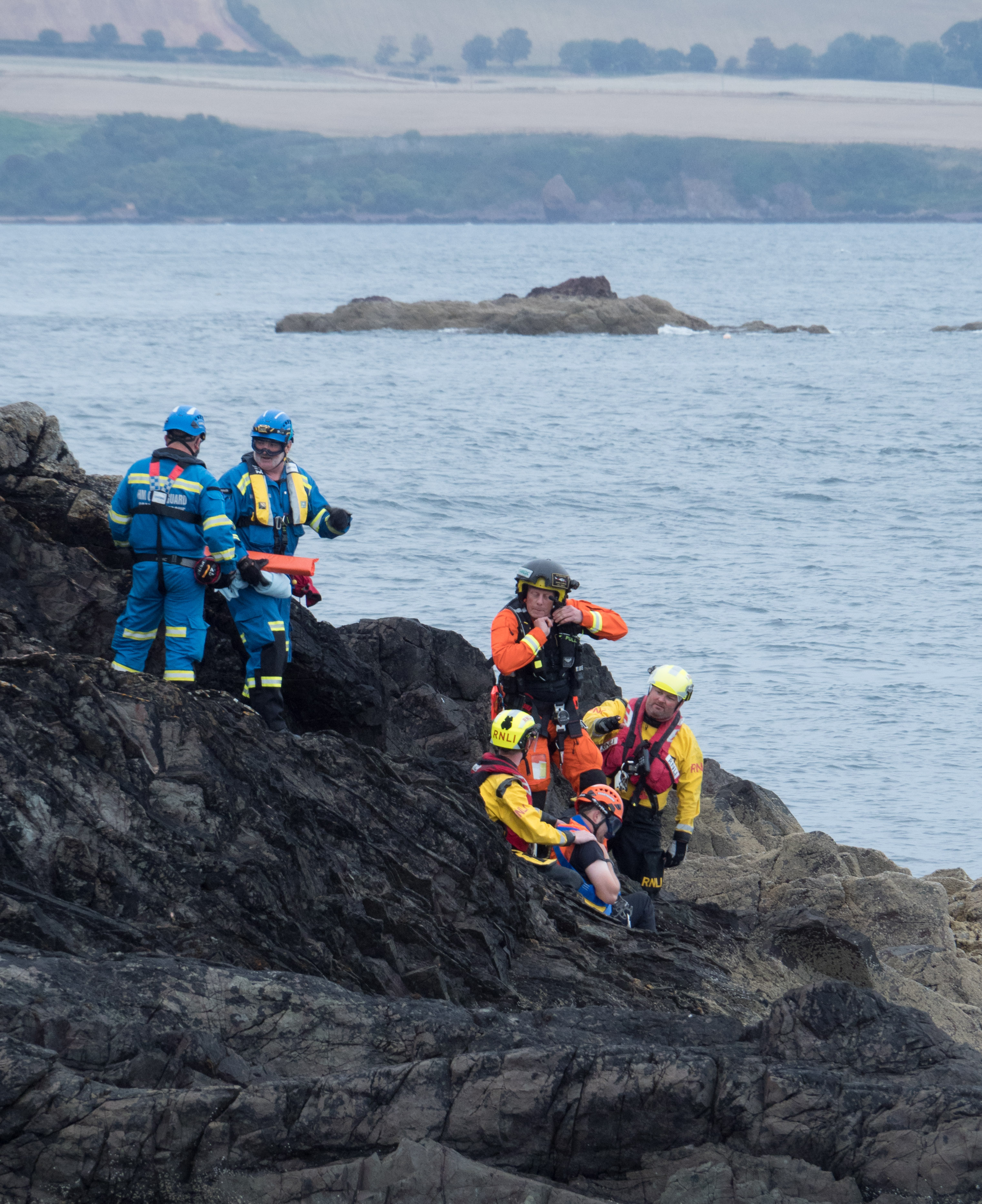 Eyemouth RNLI with Eyemouth and Berwick Coastguard teams, assist an injured person on the rocks south of Eyemouth