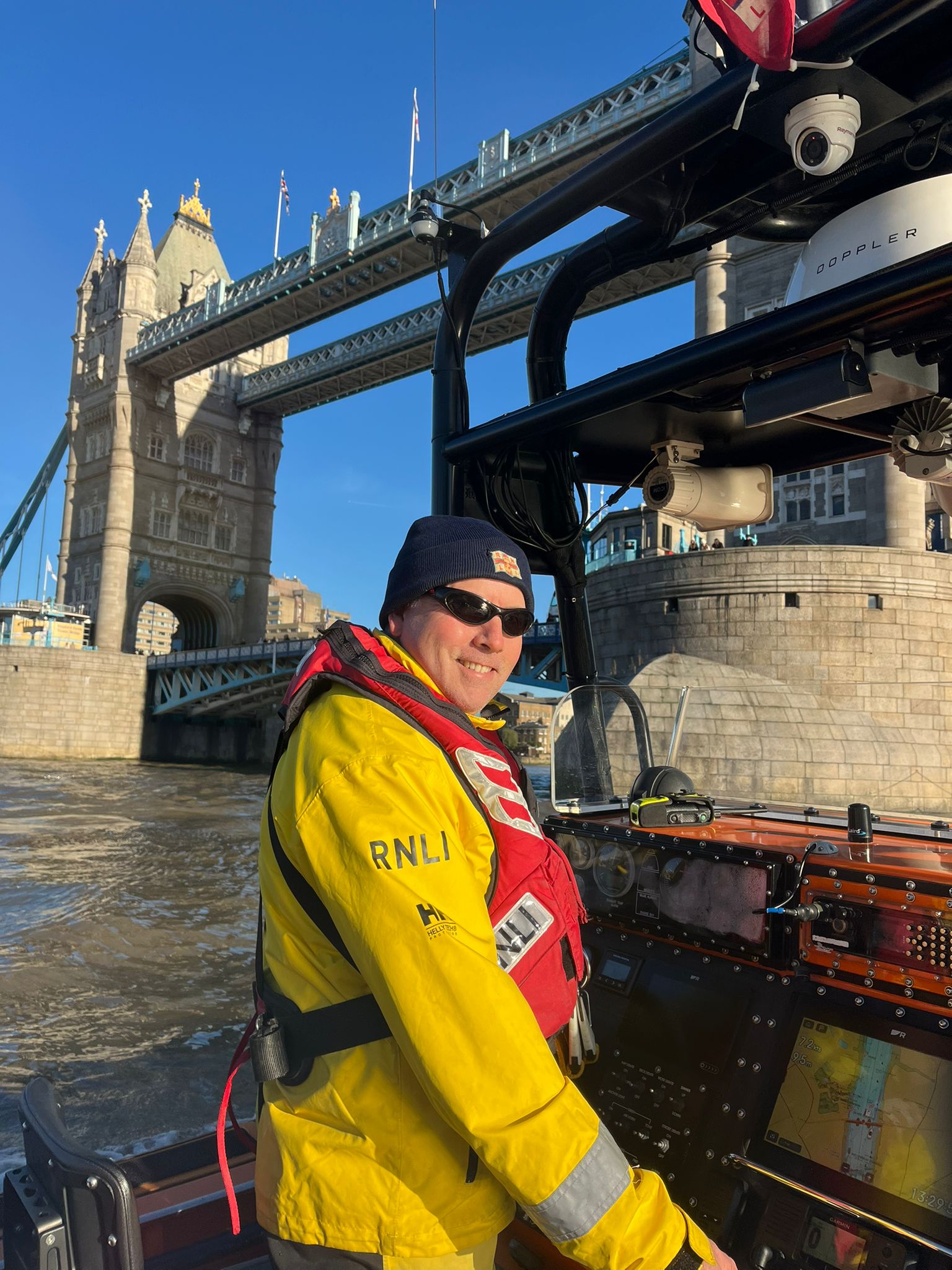 Colin on the helm near Tower Bridge