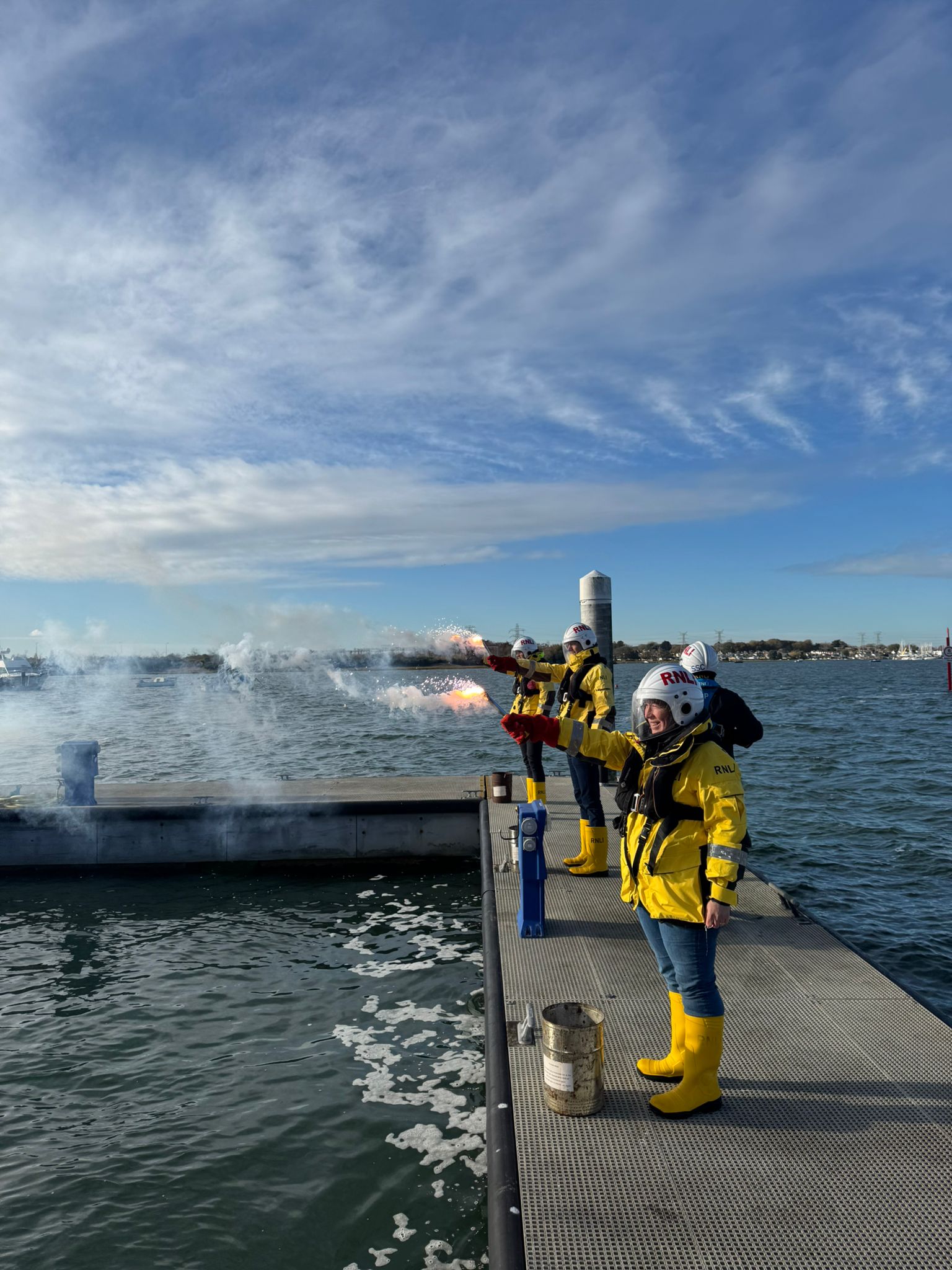 Harry (second left) and Emma (closest) firing flares at Poole.
