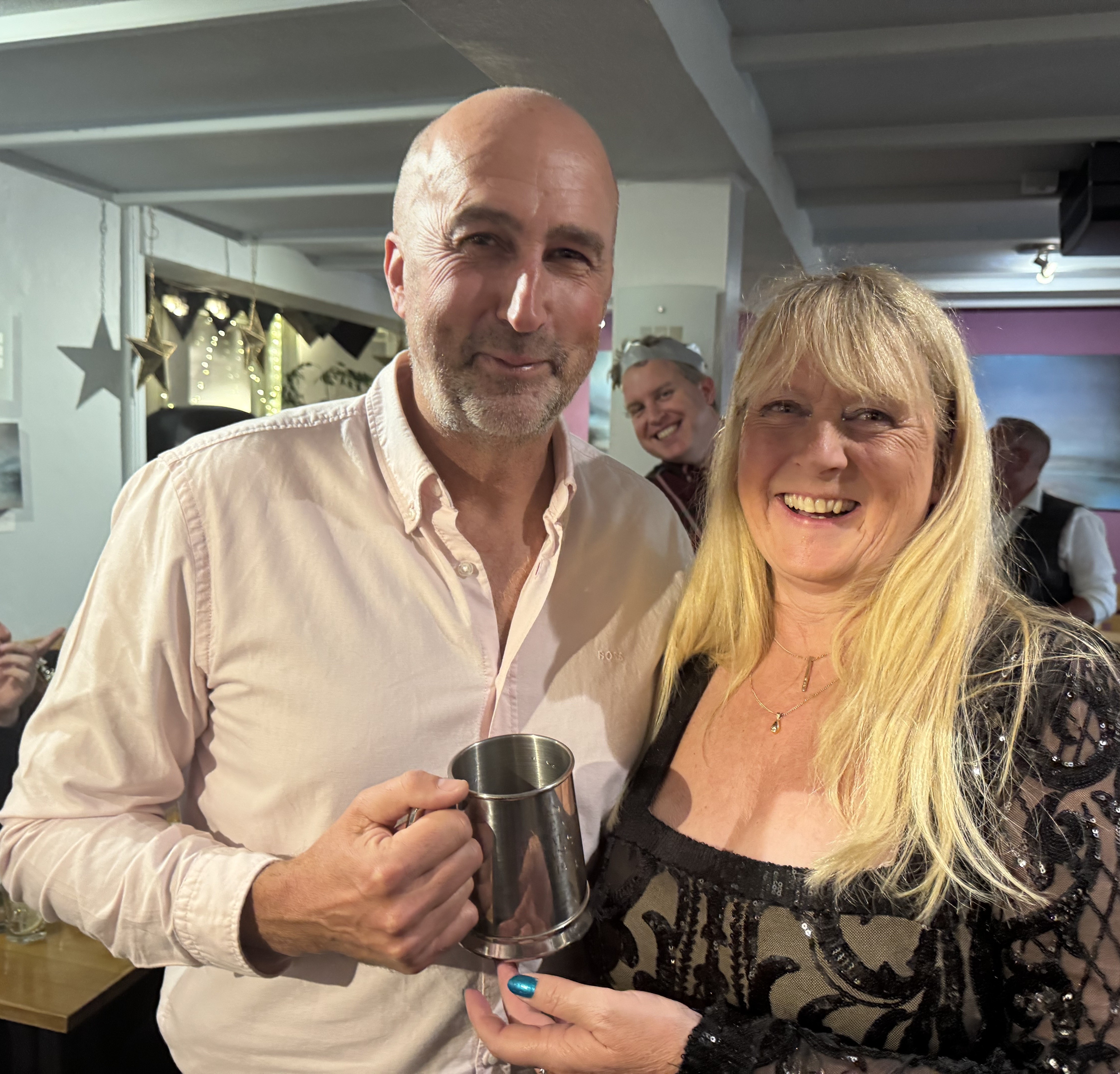 Man and woman with presentation tankard
