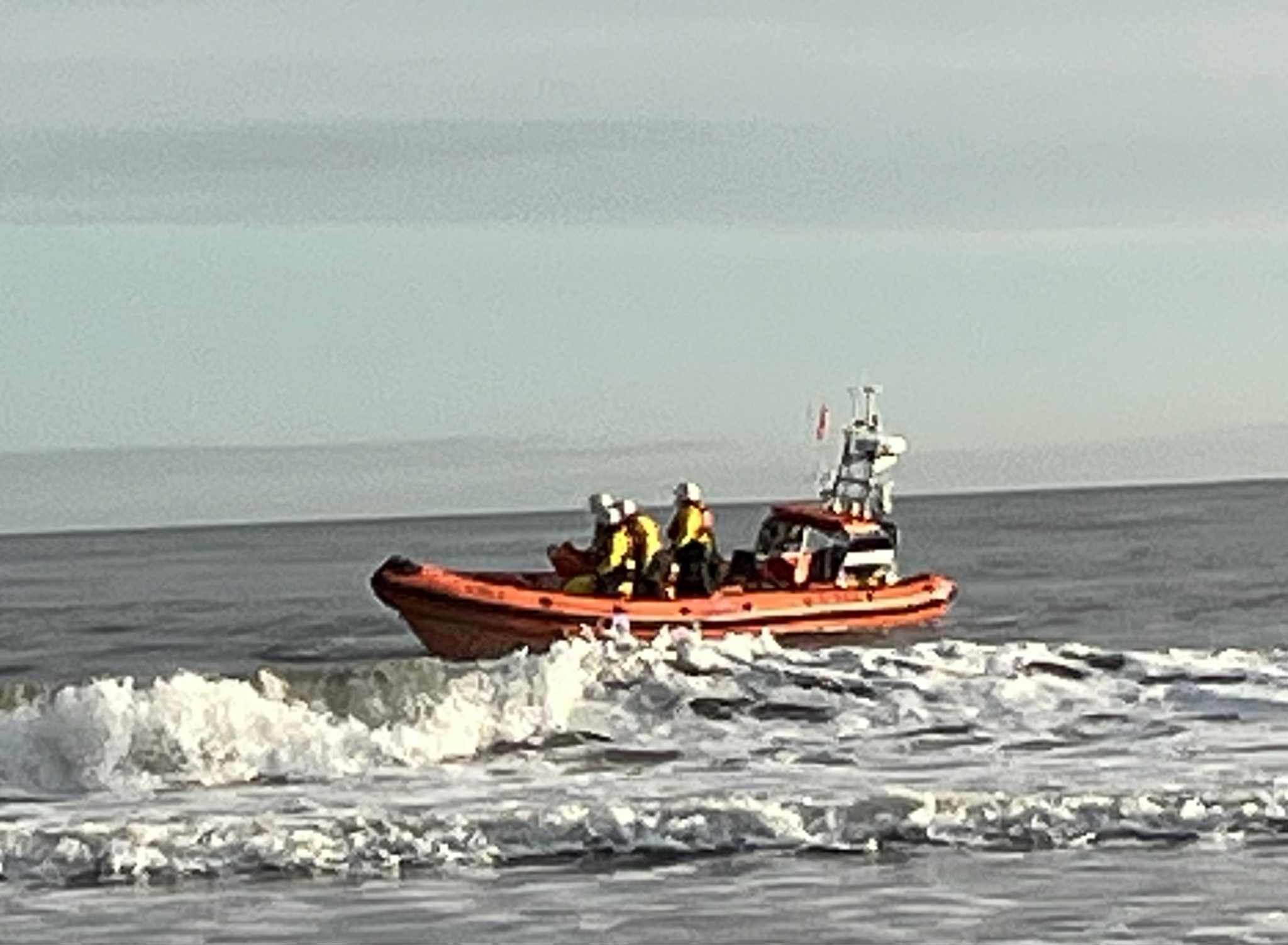 Lifeboat in the surf preparing to deploy volunteer crew ashore